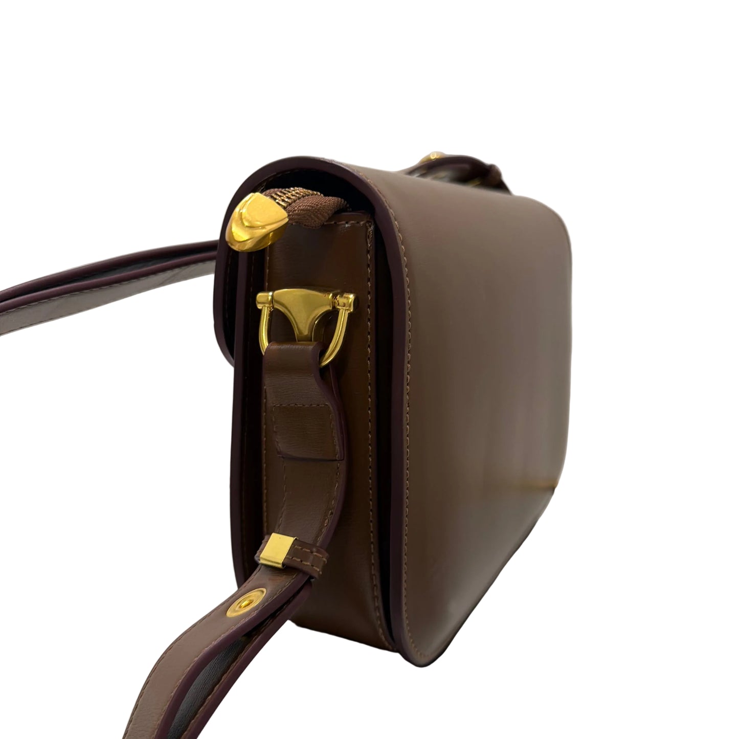 Brown leather bag with gold hardware on a white background