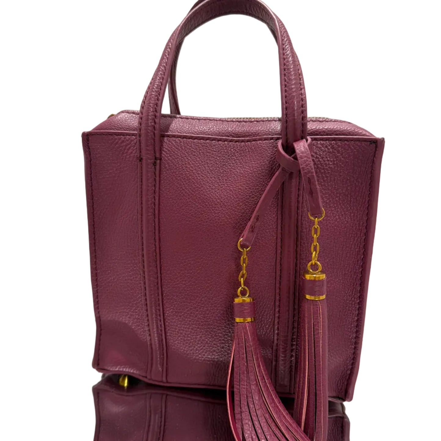 Purple handbag with gold accents on a light background