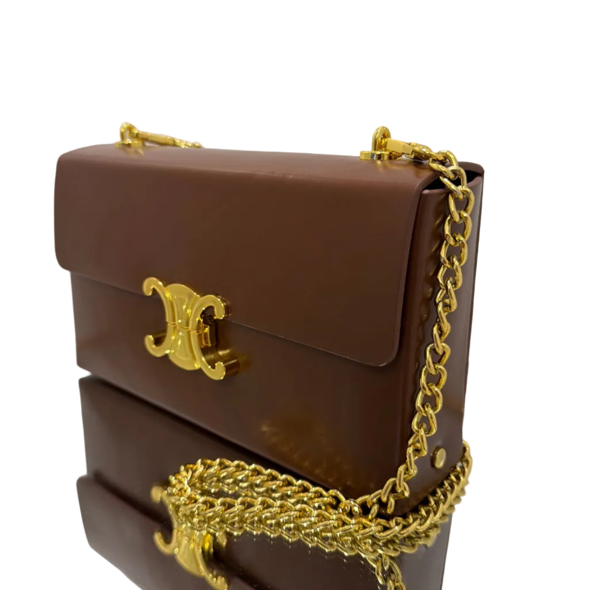 Brown handbag with gold chain strap on a white background
