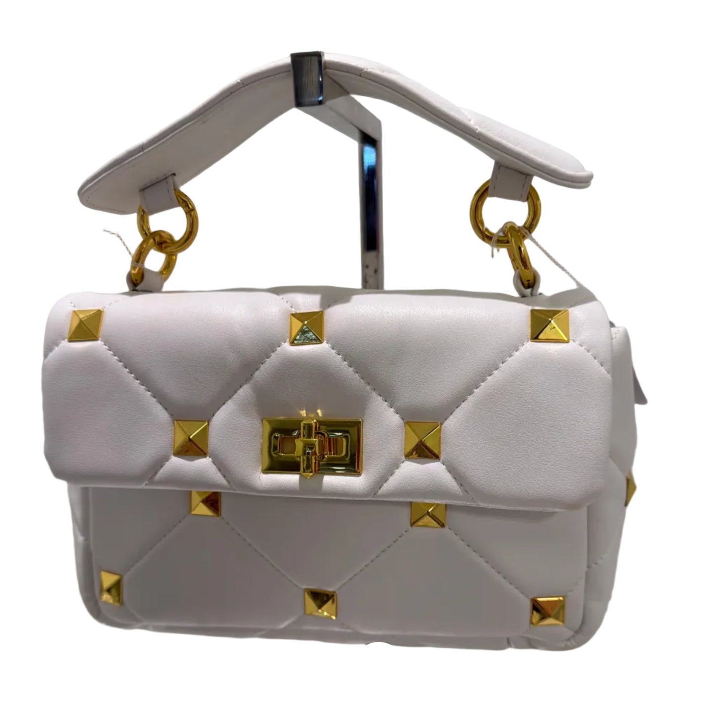 White quilted handbag with gold studs on a white background
