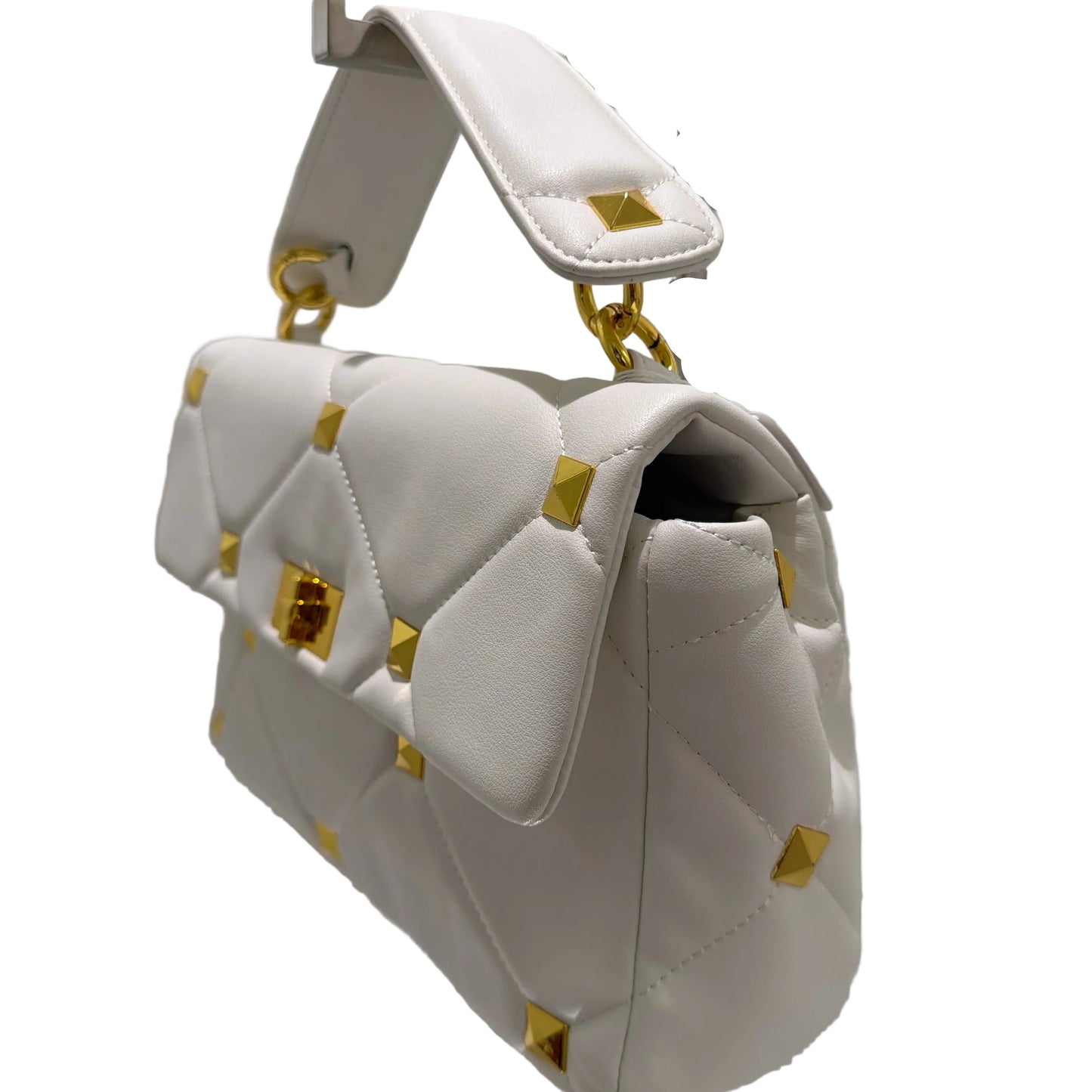 White handbag with gold accents on a light gray background