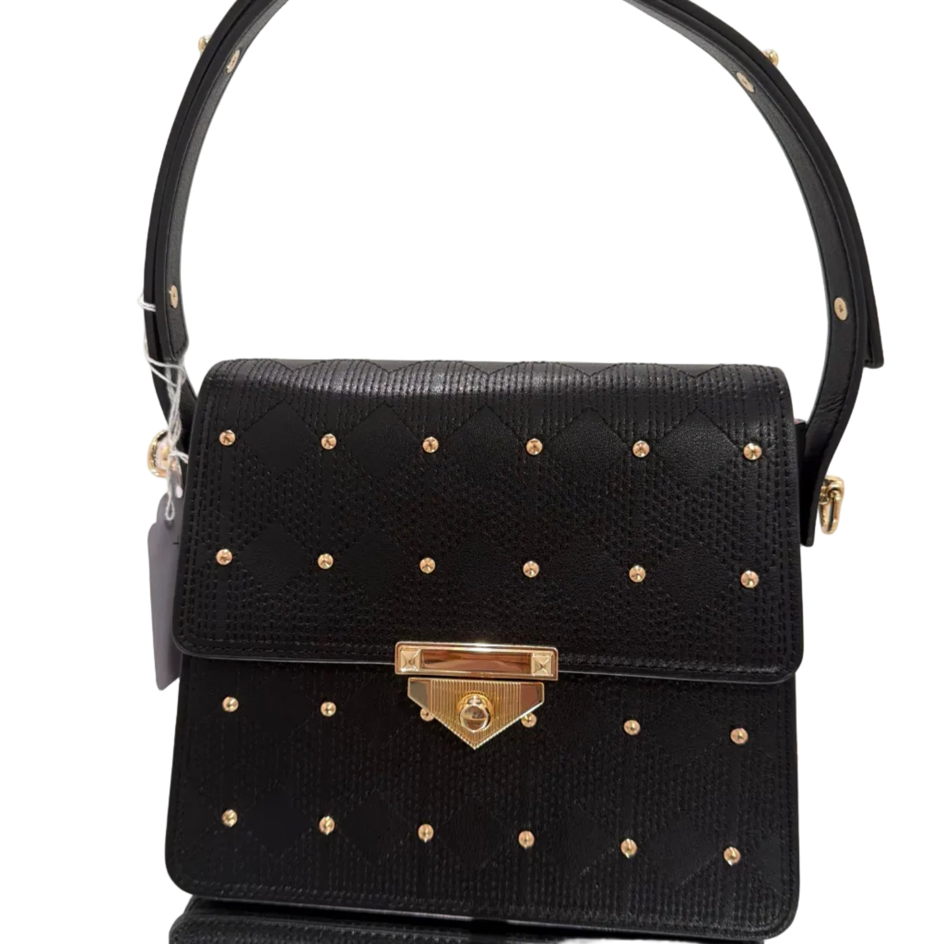 Black handbag with gold studs and a gold clasp on a light gray background