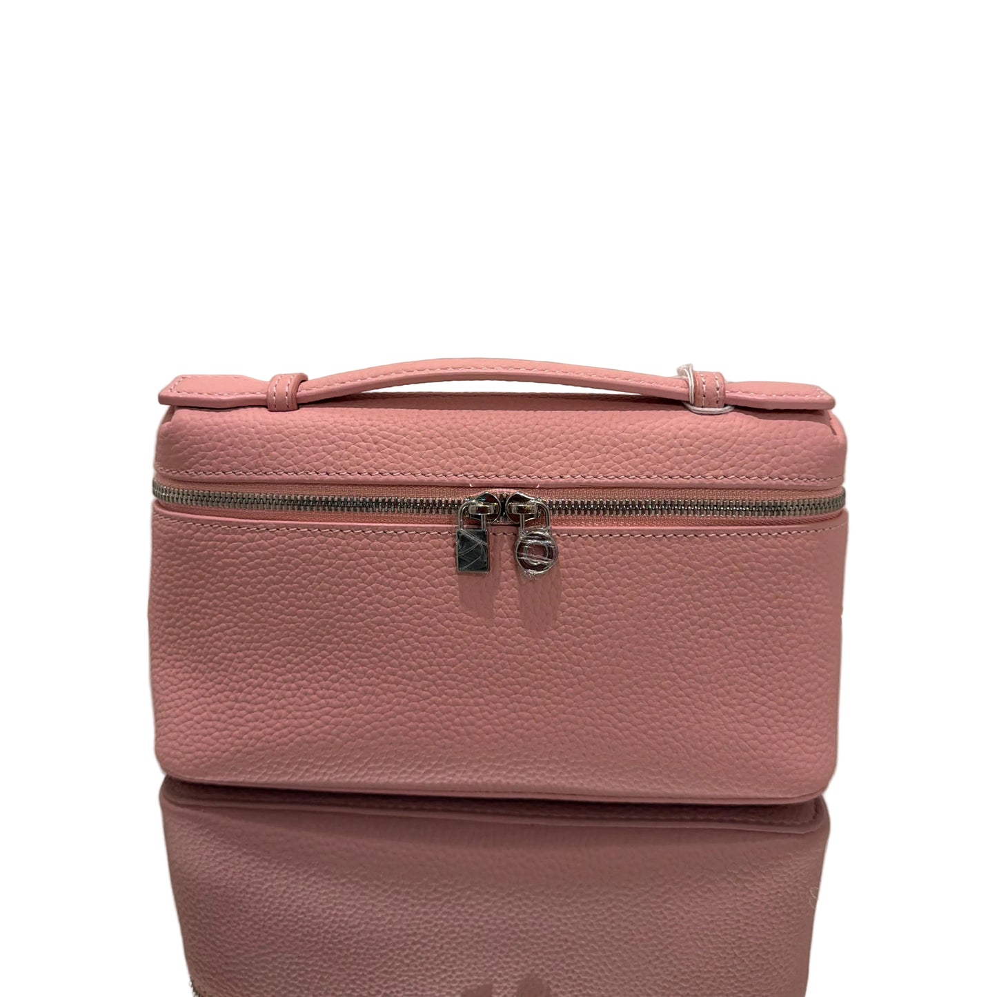 Pink suitcase on a light gray background