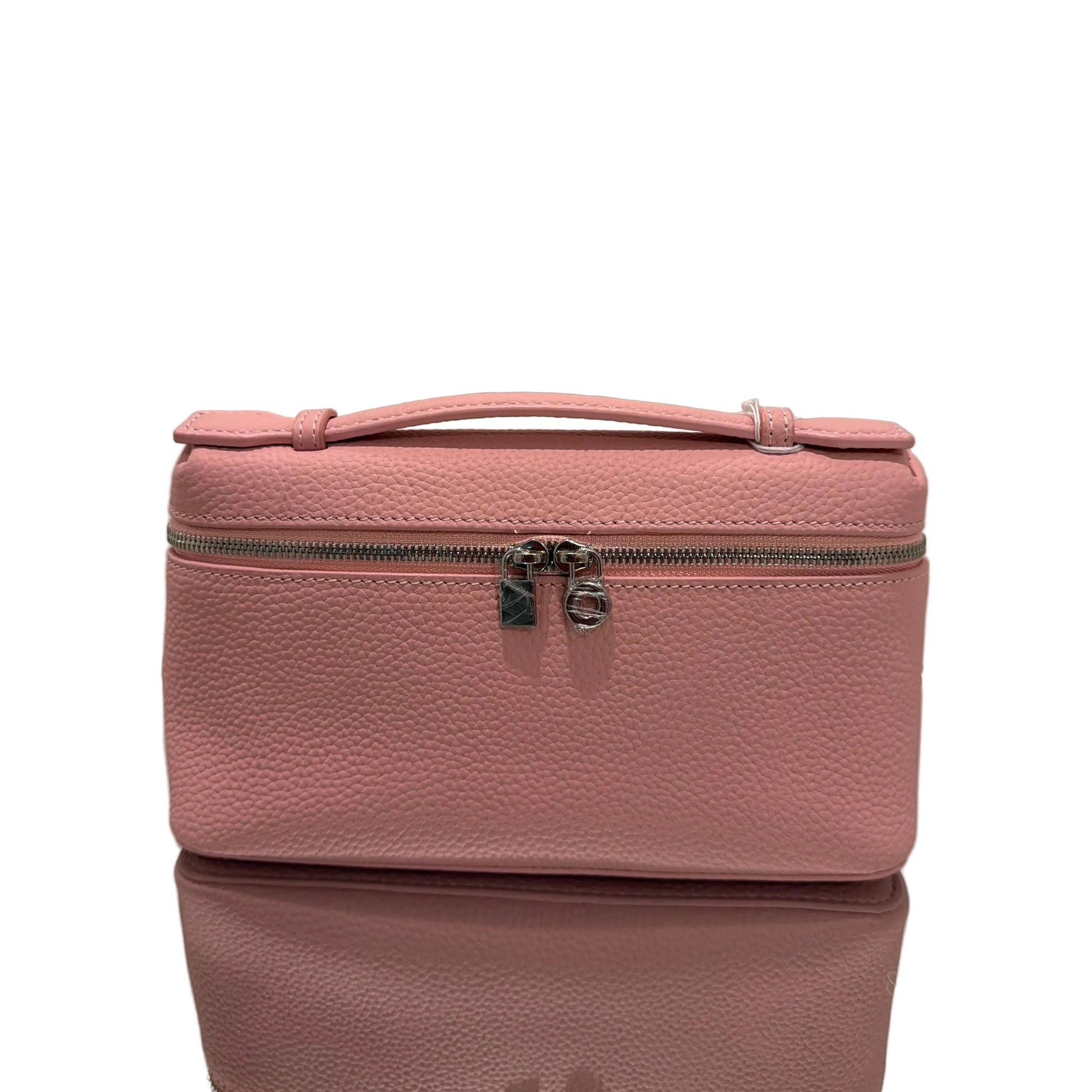 Pink suitcase on a light gray background
