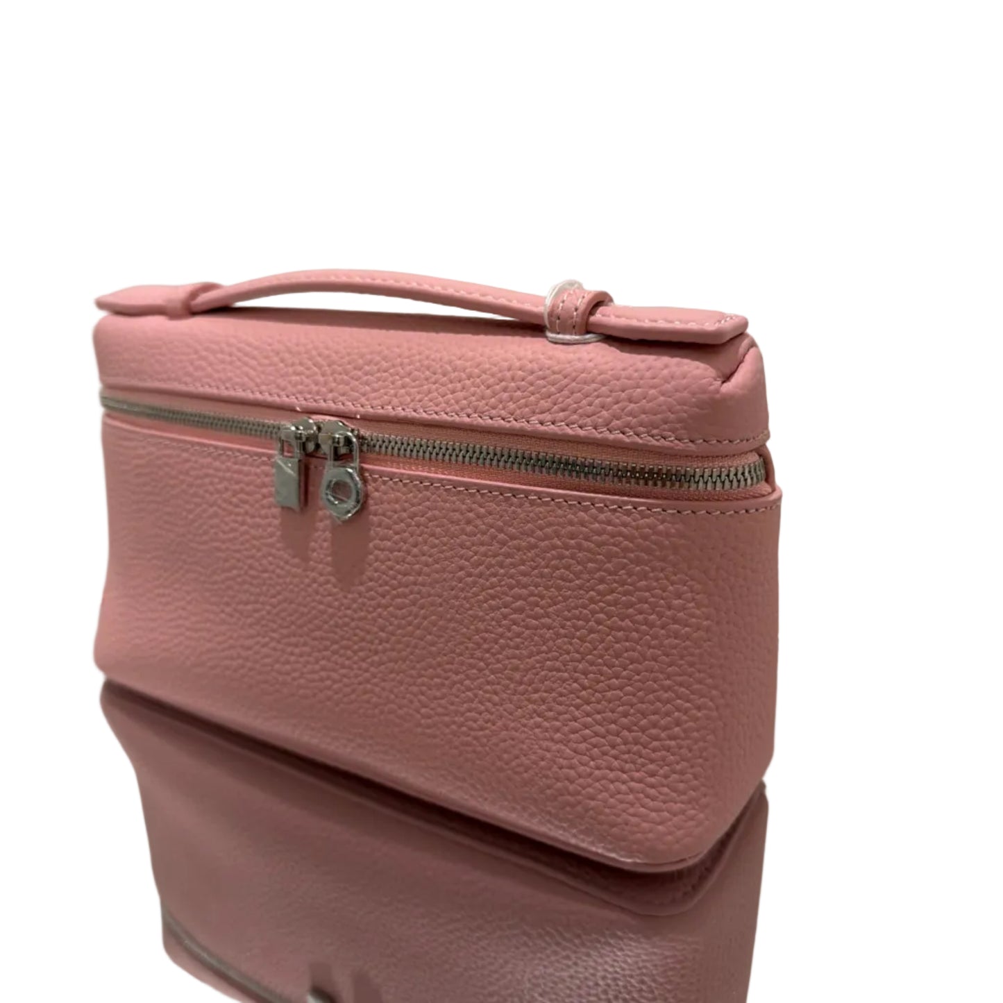 Pink backpack on a white tiled floor