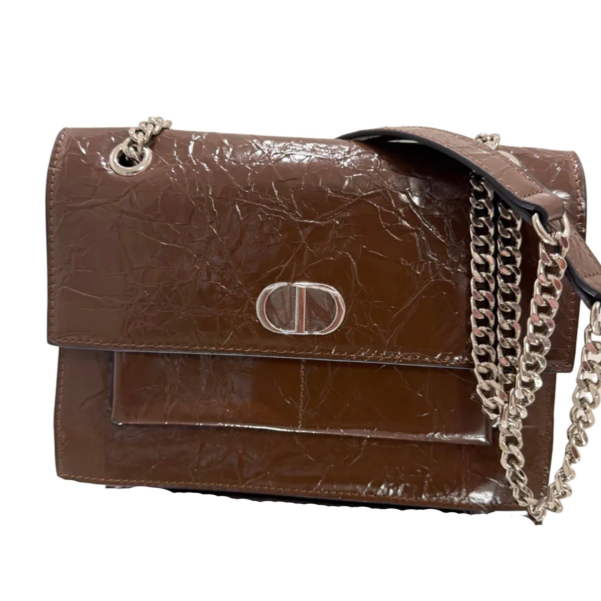 Brown leather handbag with chain detail on a light background
