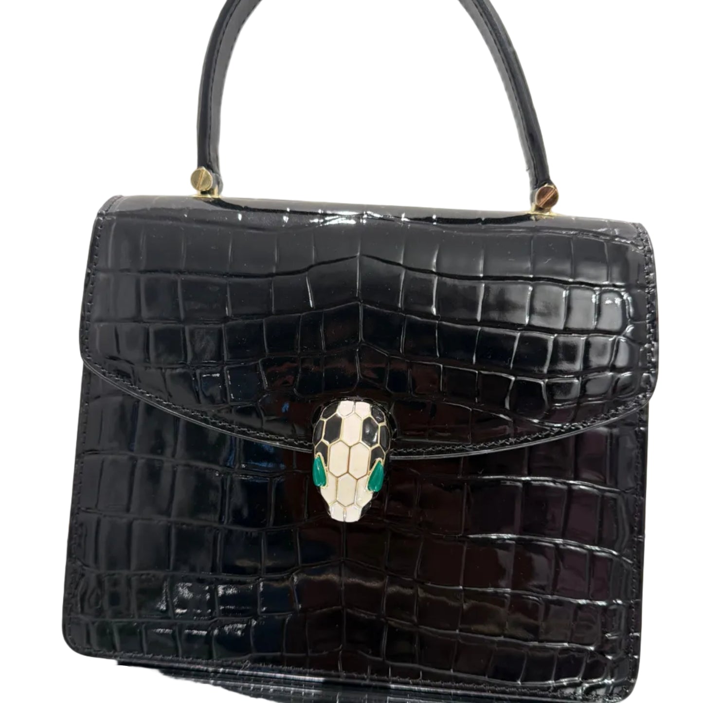 Black crocodile-patterned handbag with a decorative clasp on a light background