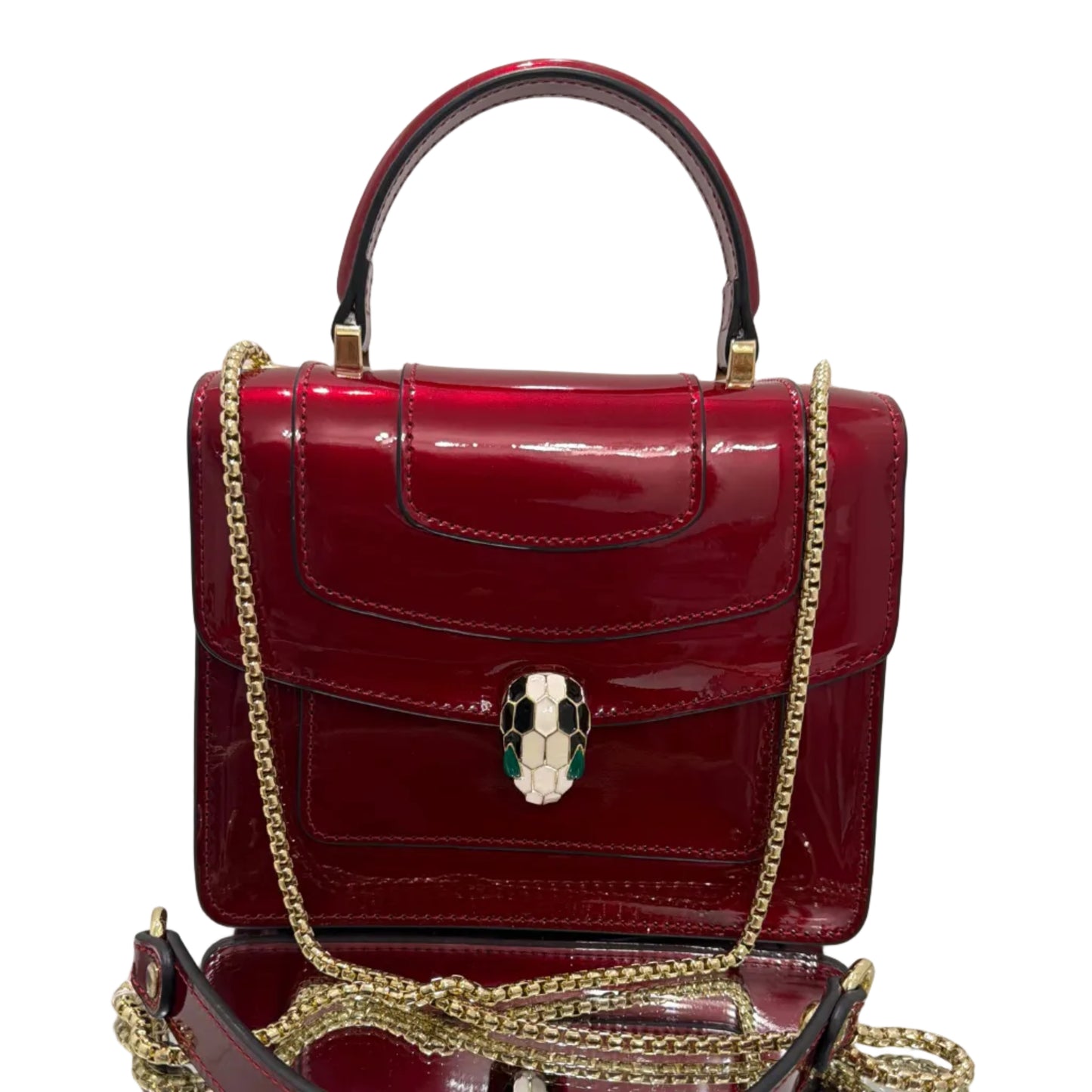 Red handbag with gold chain strap on a white background