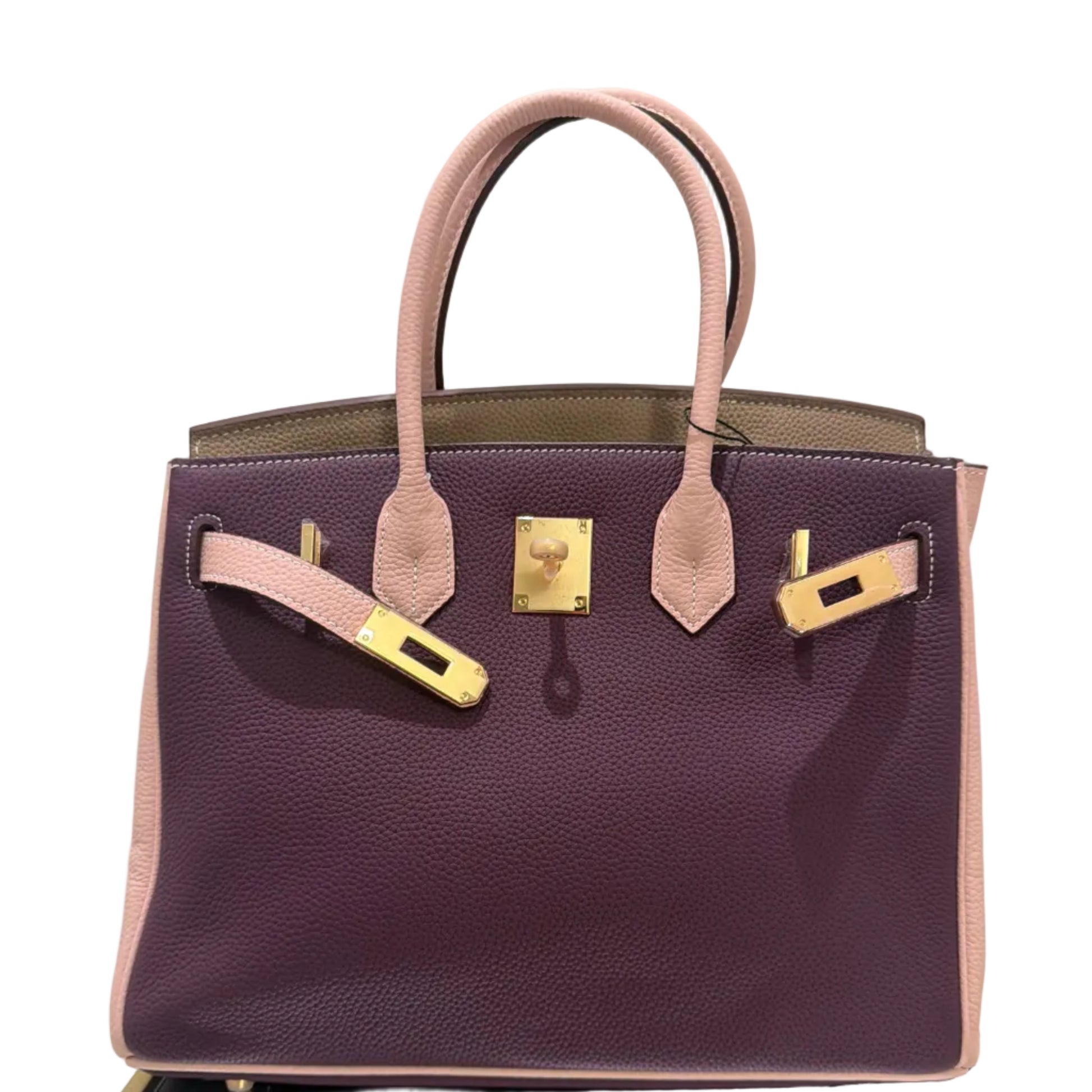 Purple handbag with gold hardware on a light gray background
