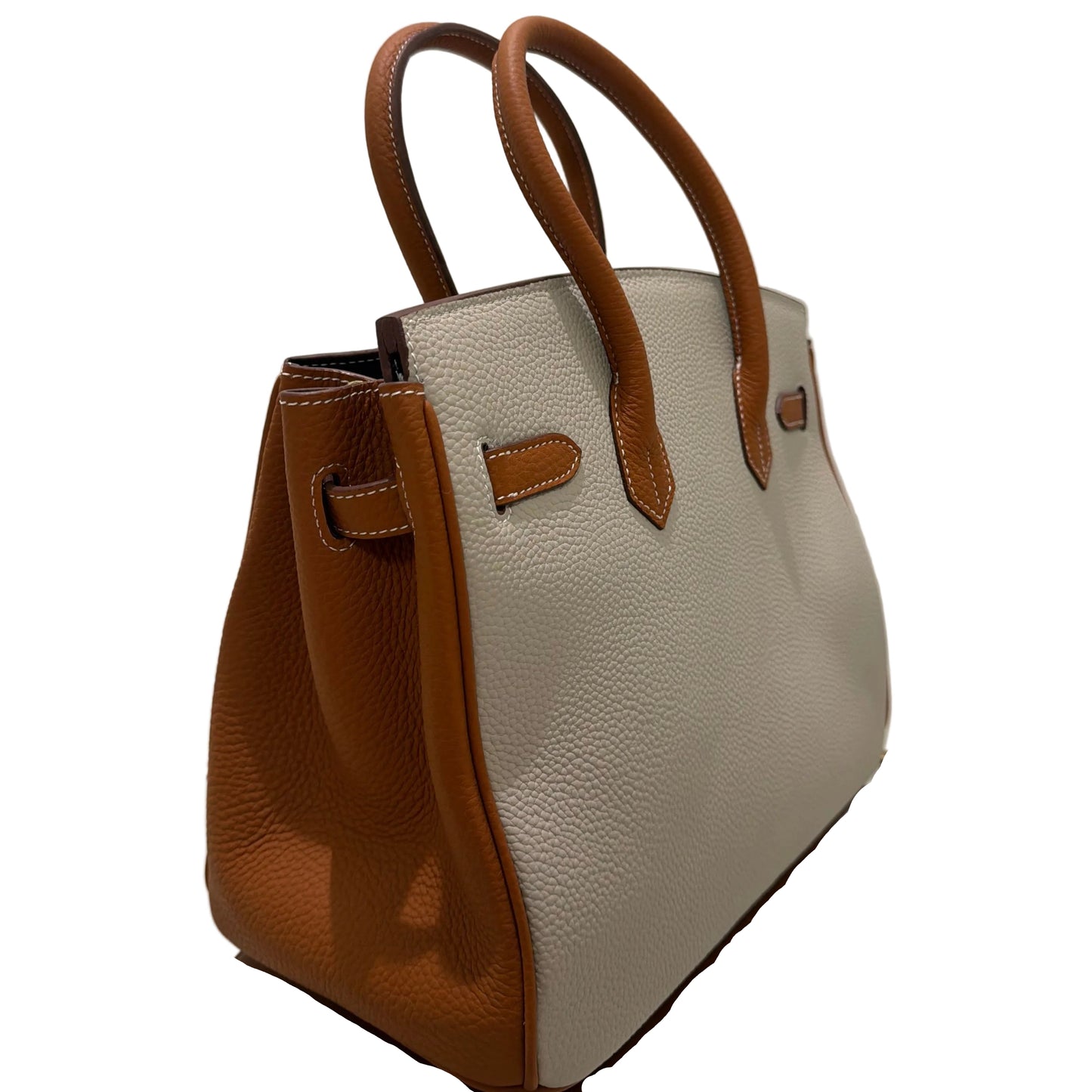 Beige handbag with brown accents on a white background