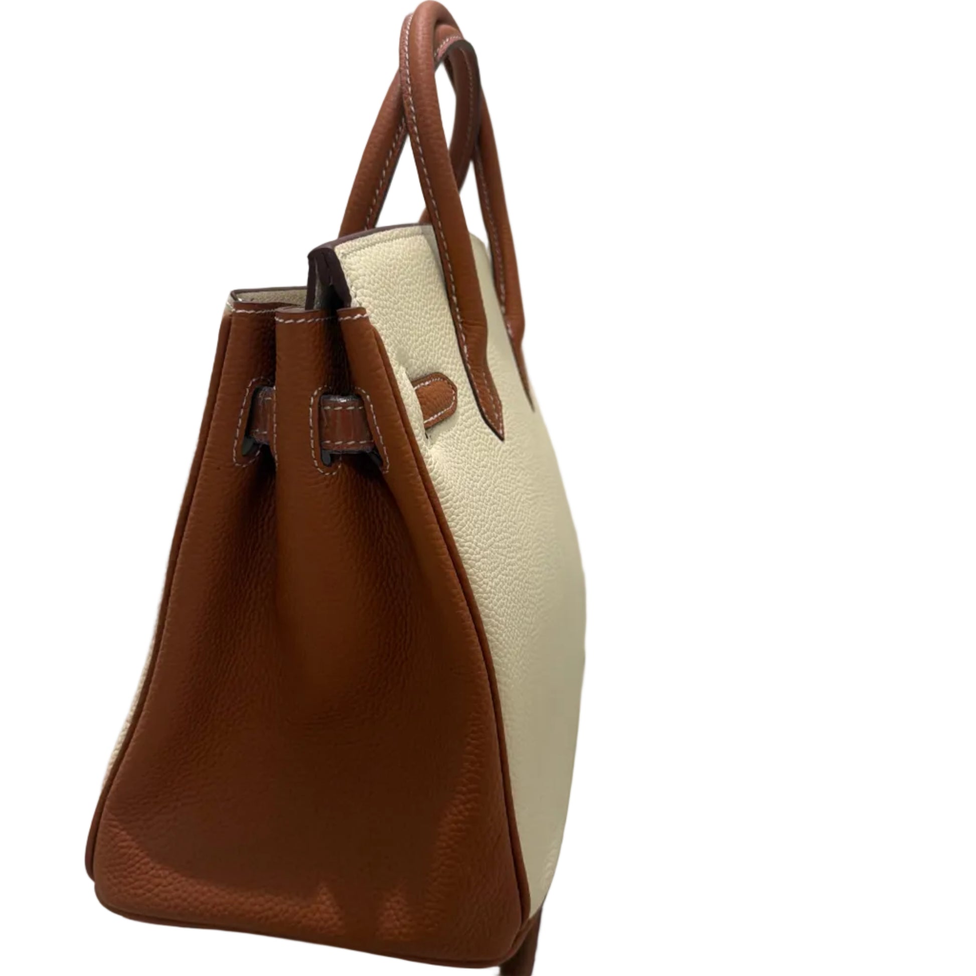 Brown and beige handbag on a white background