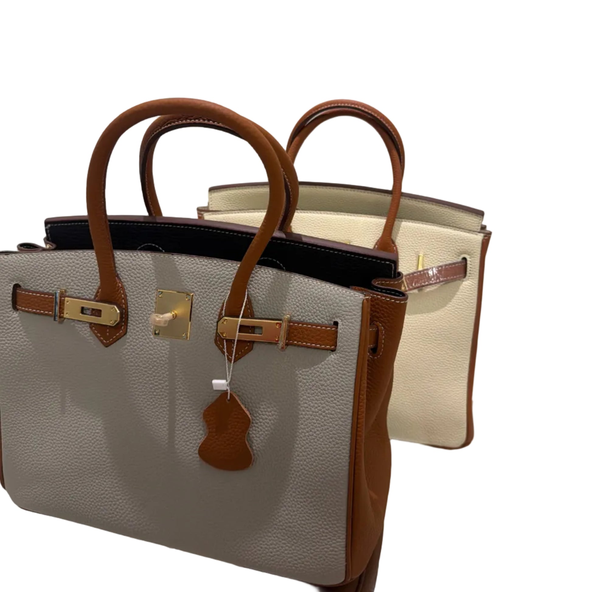 Designer handbag with brown handles and trim on a white background