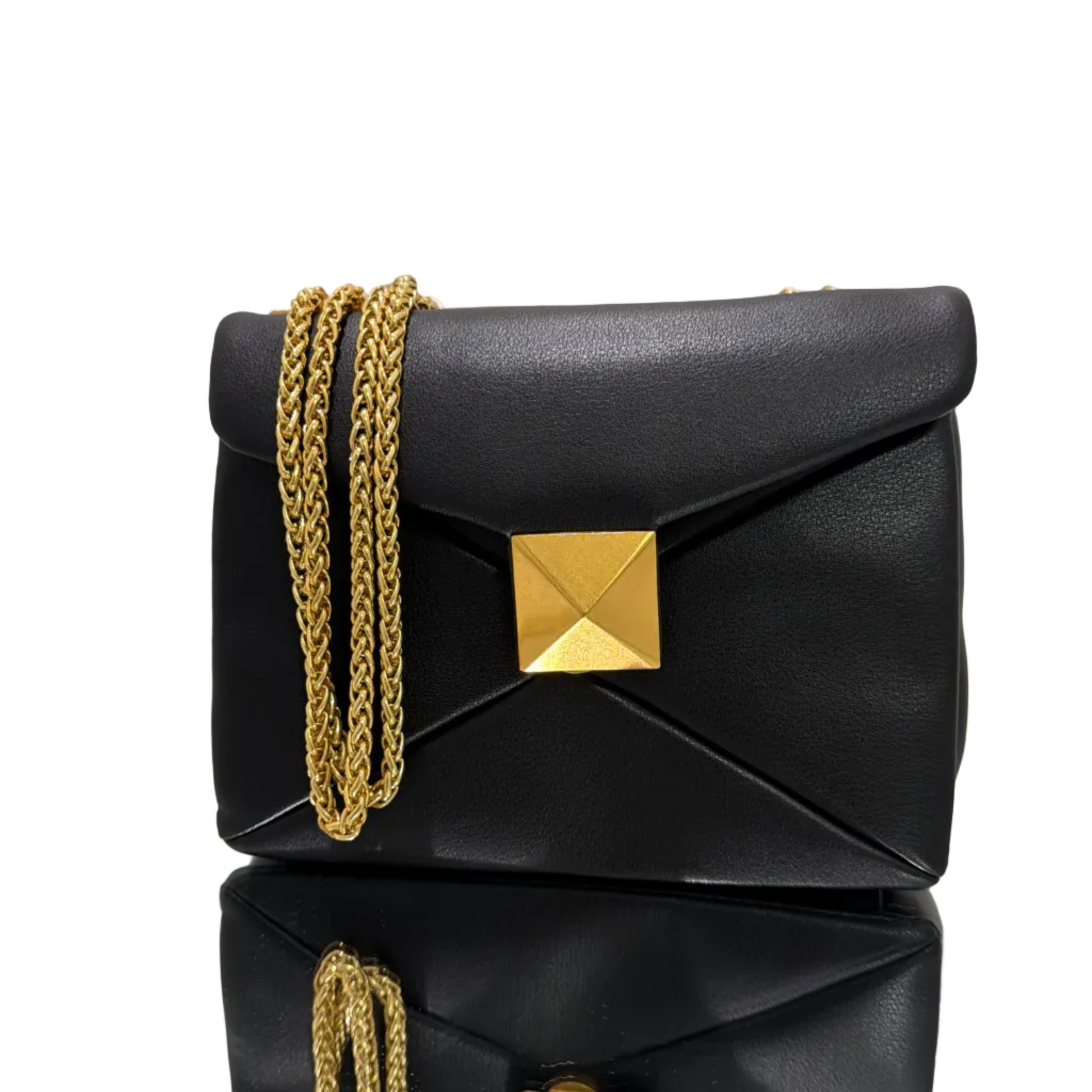 Black handbags with gold accents on a light gray background