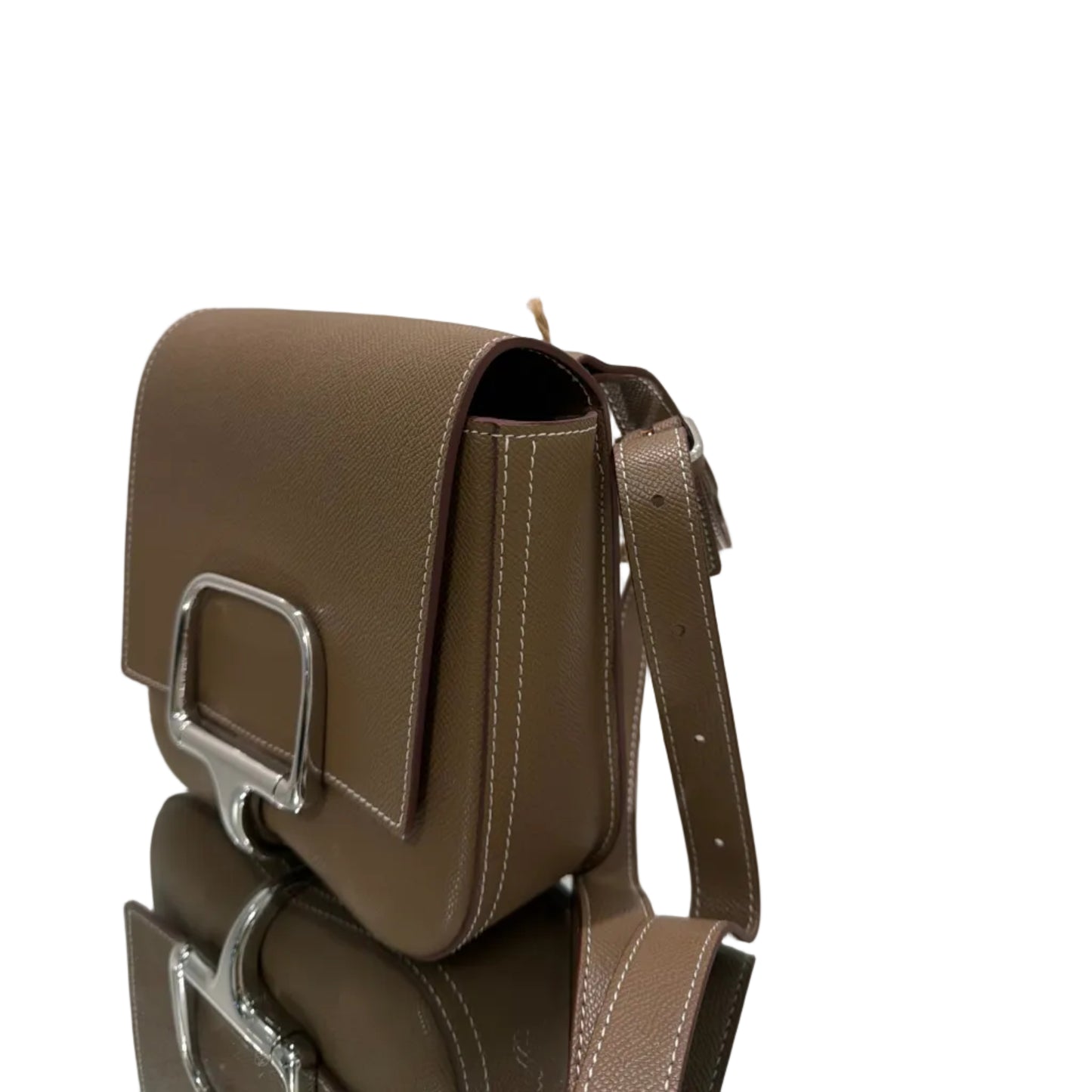 Brown leather bag with gold accents on a white background