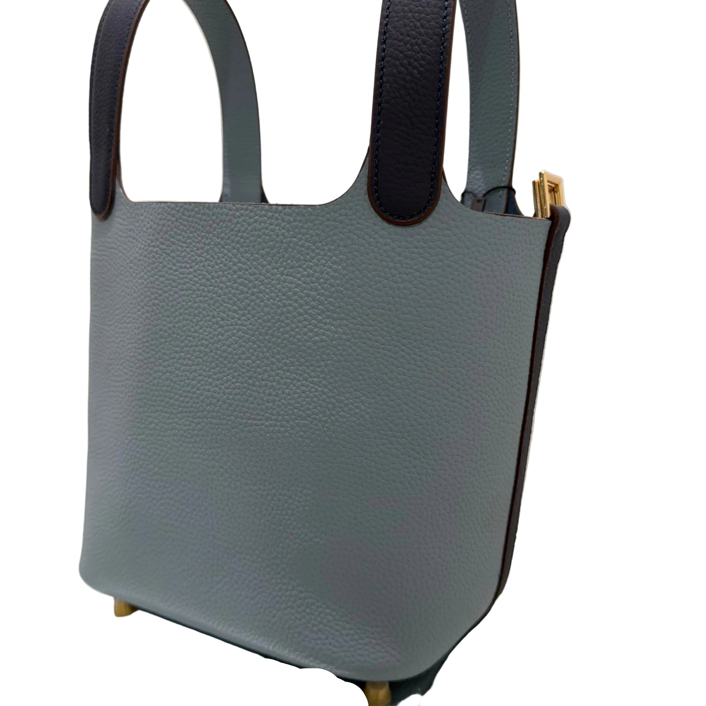 Gray handbag with black straps on a white surface