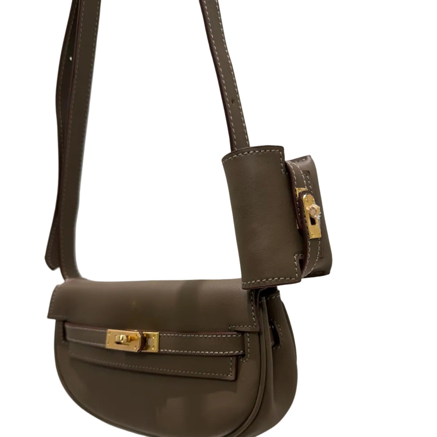 Brown leather handbag with gold accents on a white background
