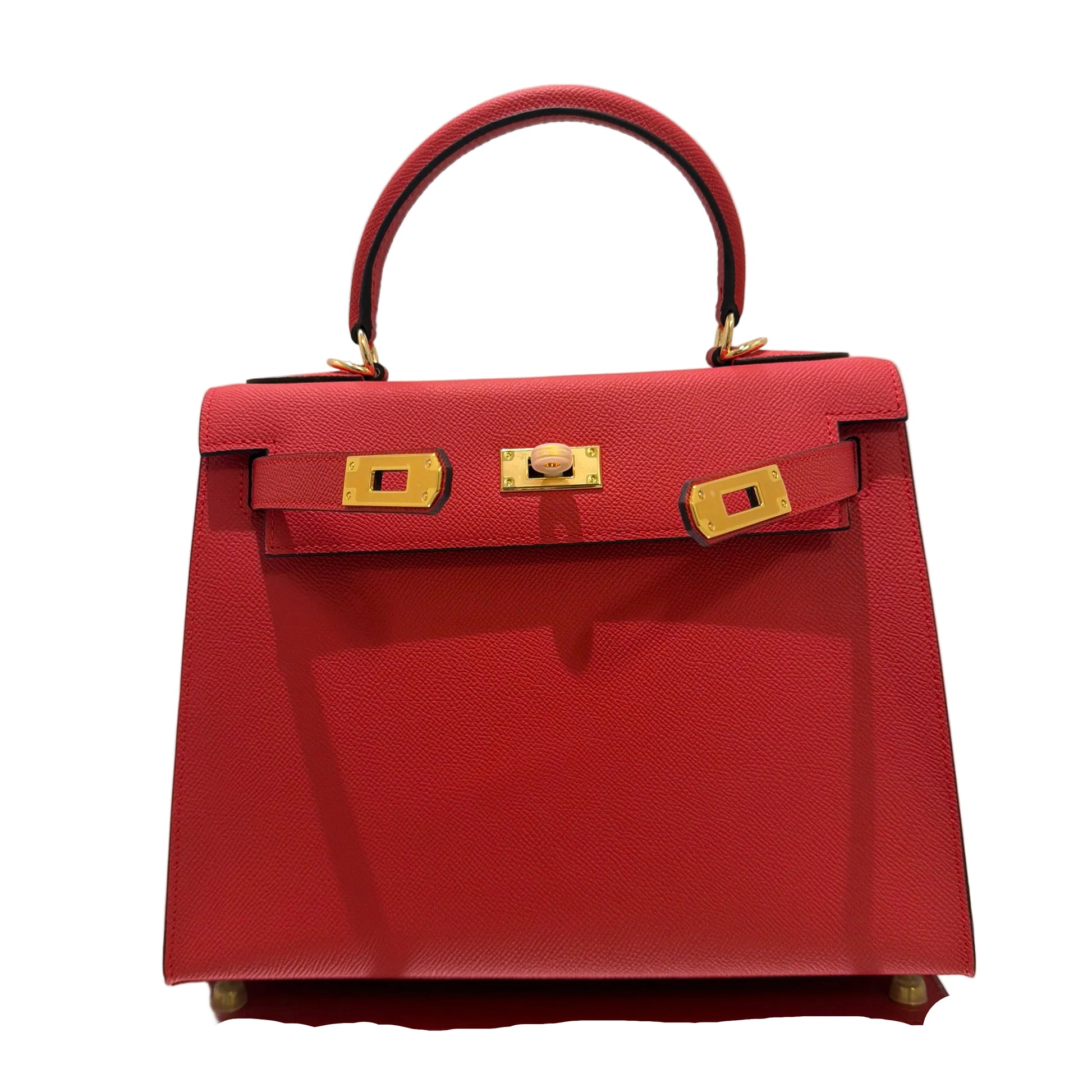 Red handbag with gold hardware on a light gray background