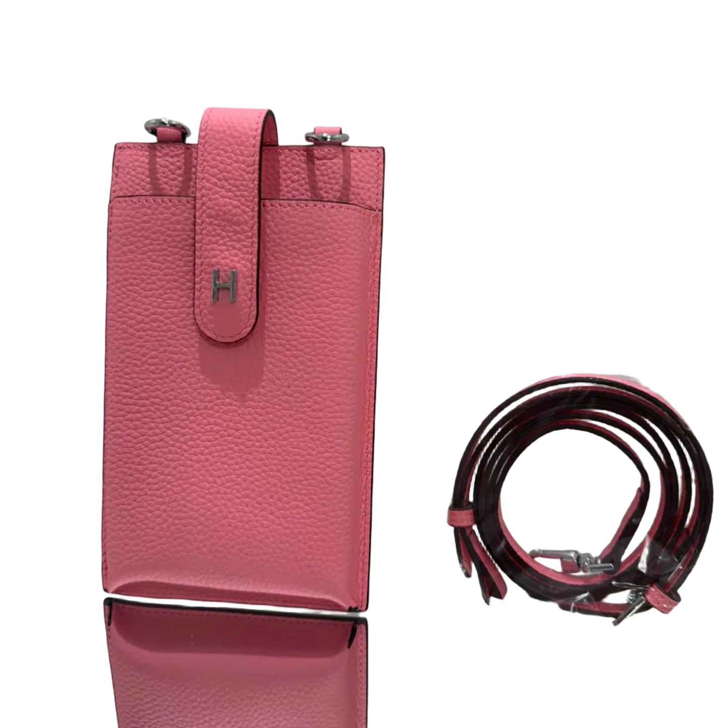 Pink handbag with matching belt on a white background