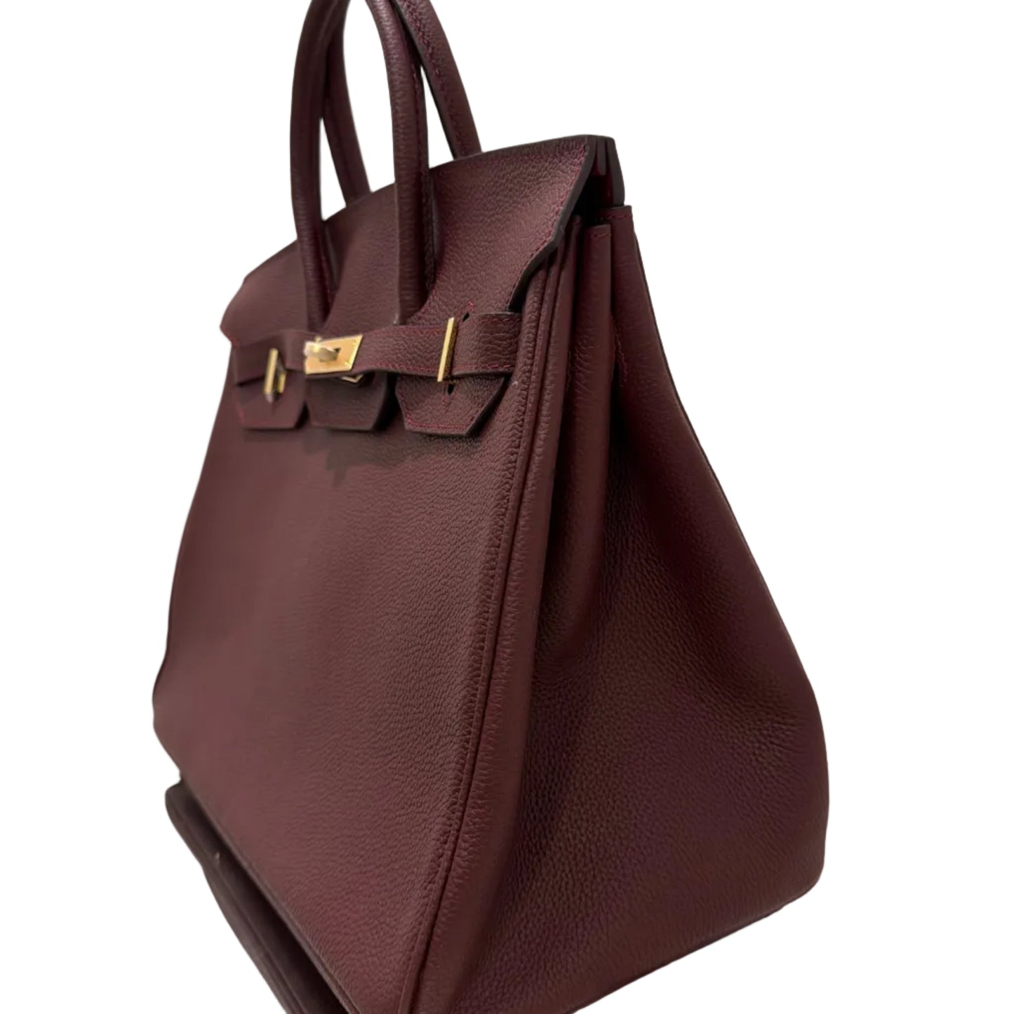 Brown leather handbag on a white background