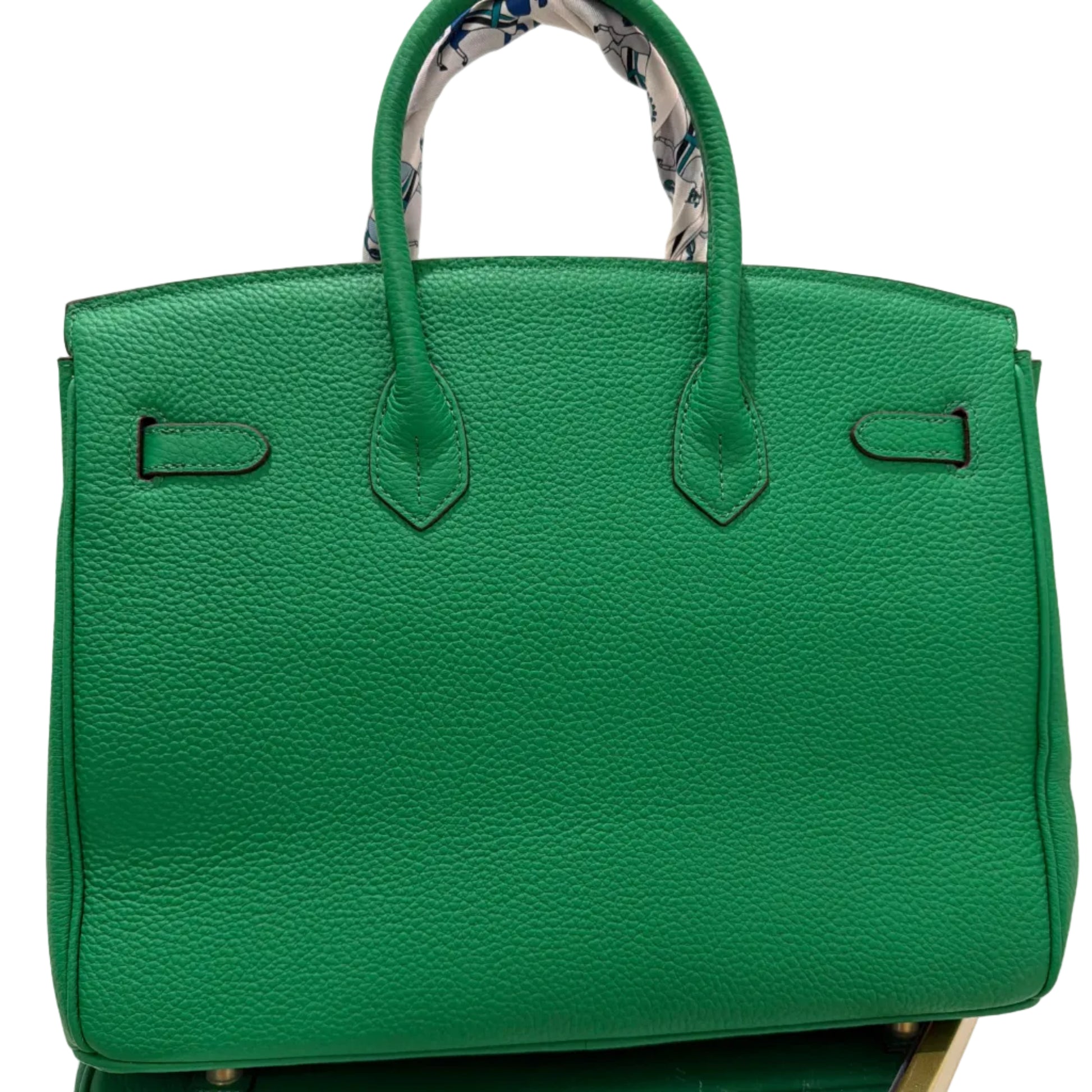 Green handbag on a white background