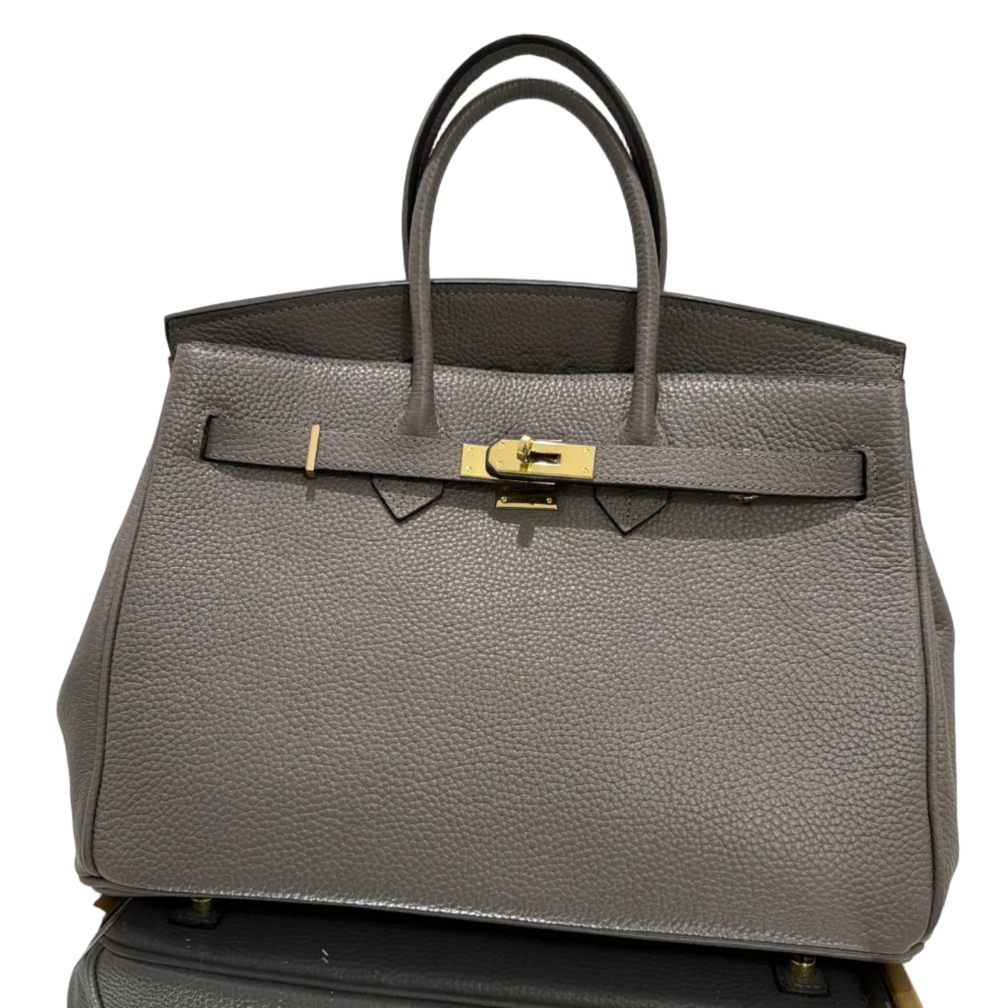 Gray textured handbag with gold clasp on a white background