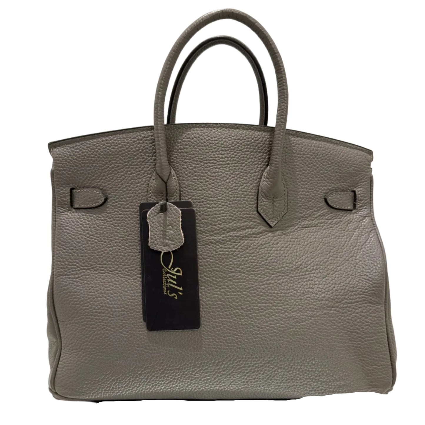 Gray leather handbag with a visible brand label on a light background