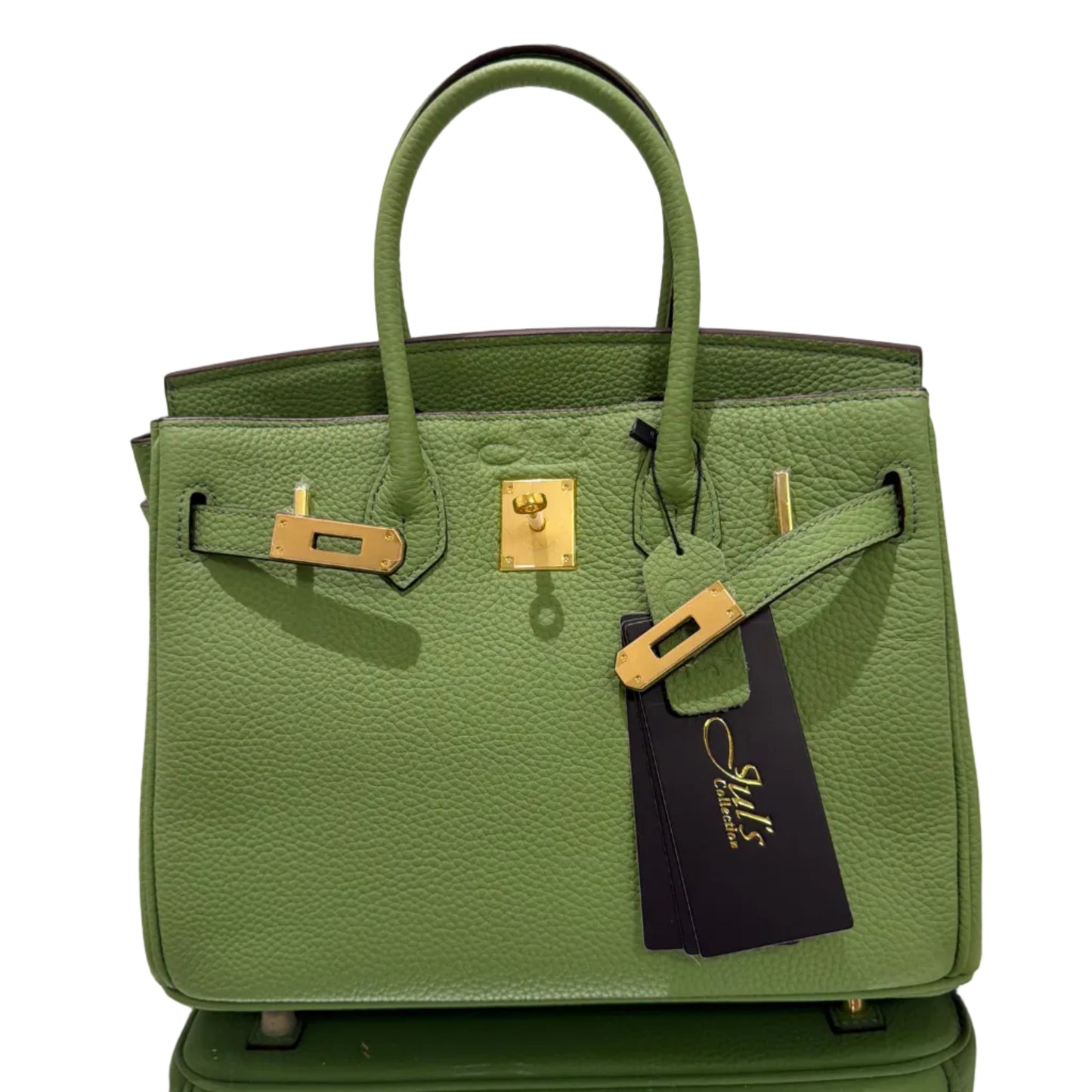 Green handbag with gold hardware on a white background