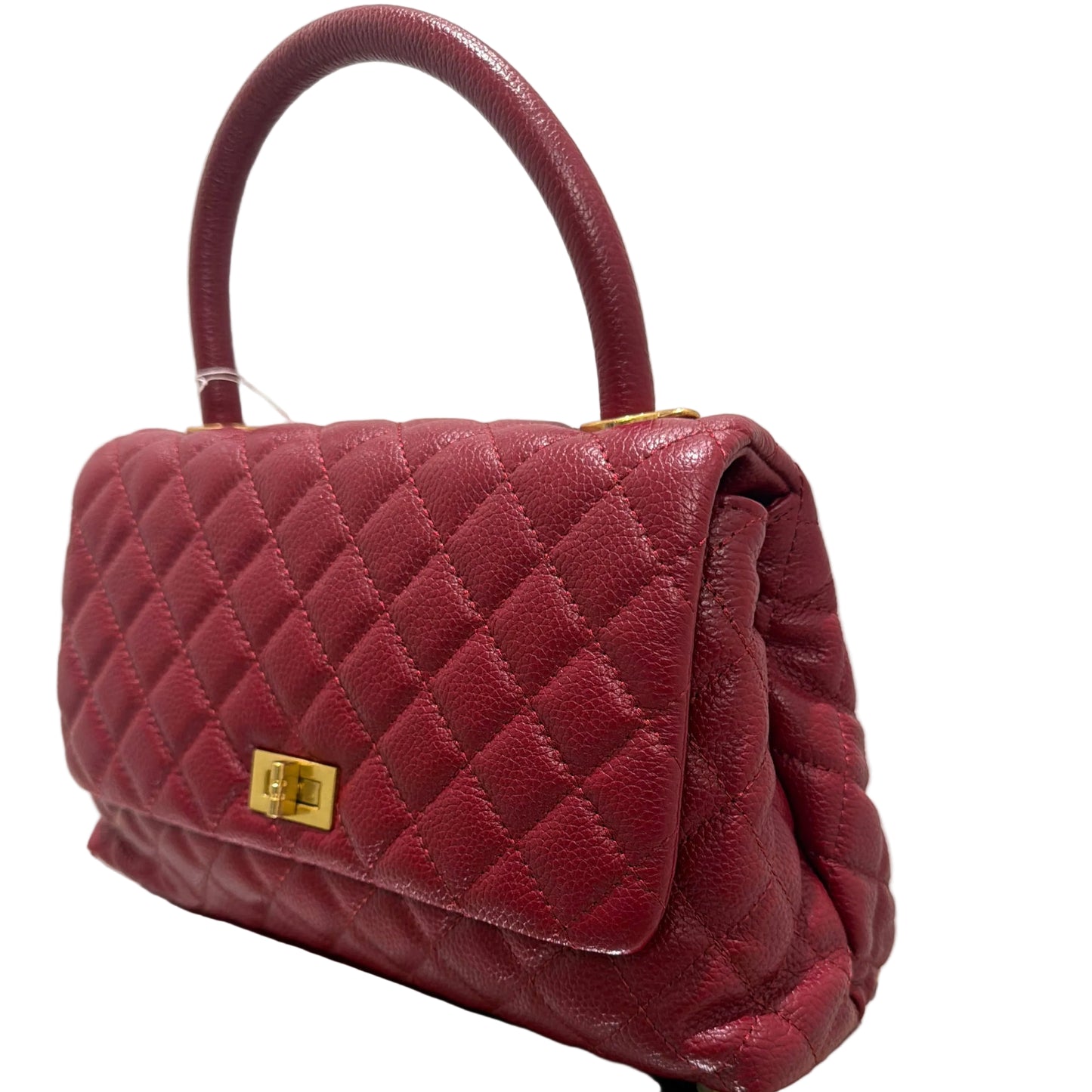 Maroon quilted handbag with gold hardware on a white background