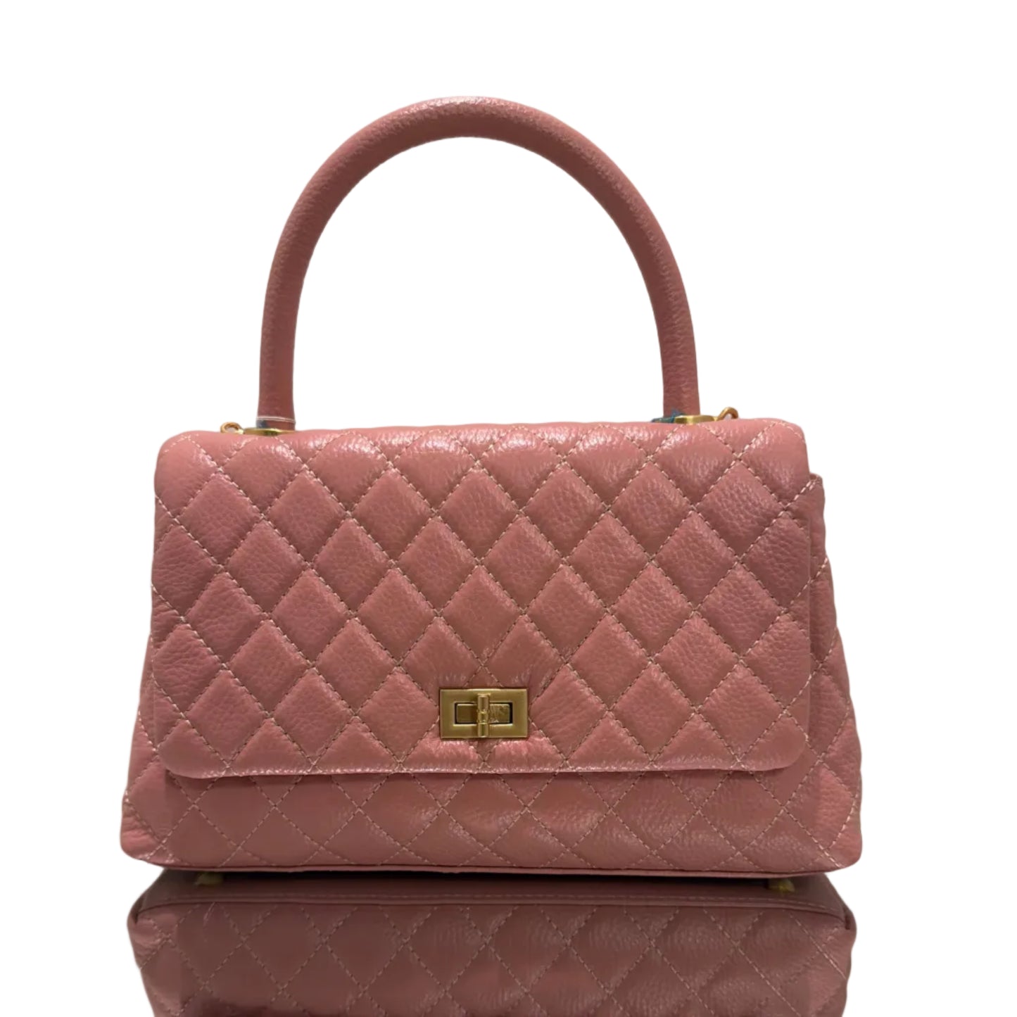Pink quilted handbag with gold accents on a light background