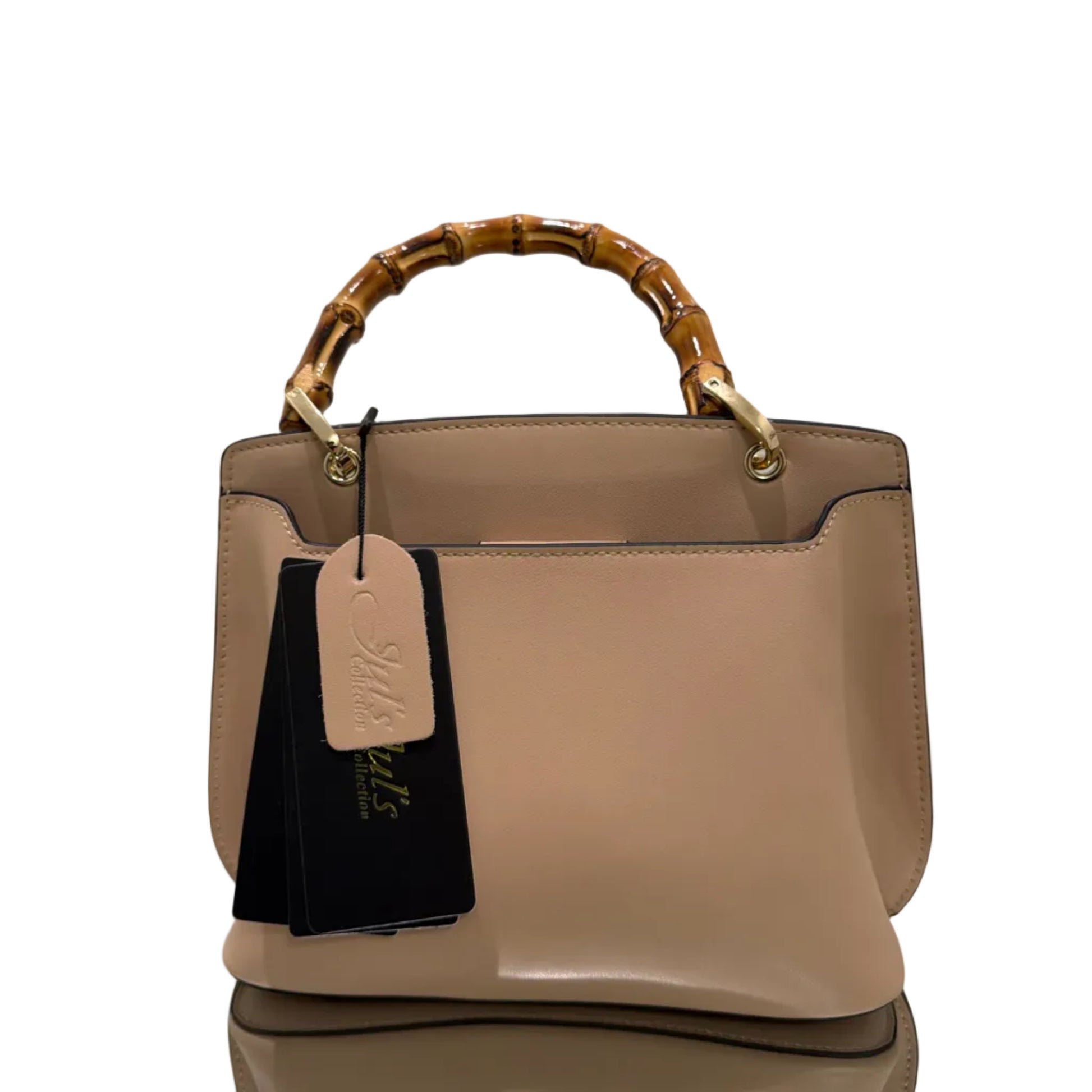 Beige handbag with wooden handle and visible brand tag on a light background