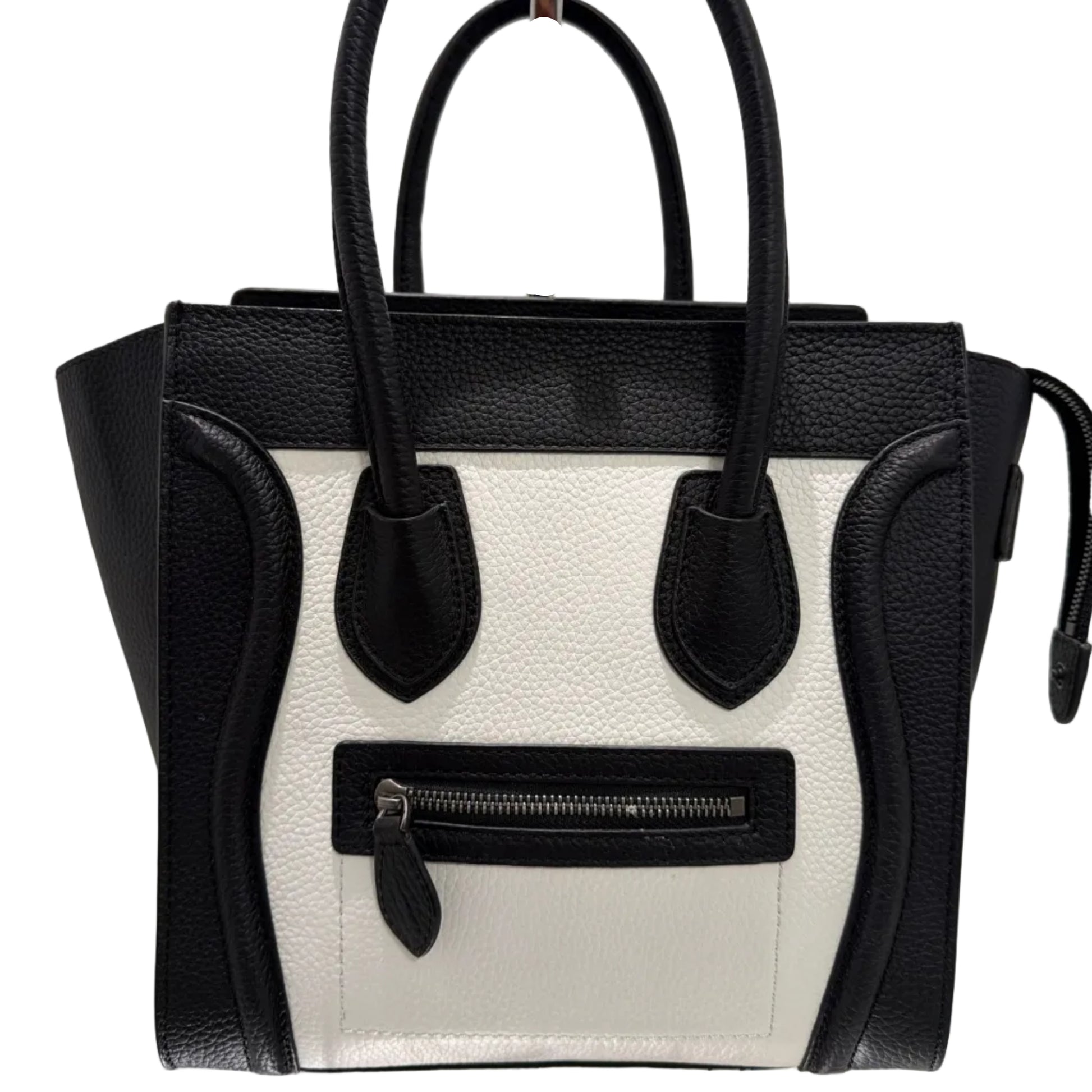 Black and white handbag with a visible brand logo on a light background