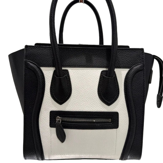 Black and white handbag with a visible brand logo on a light background