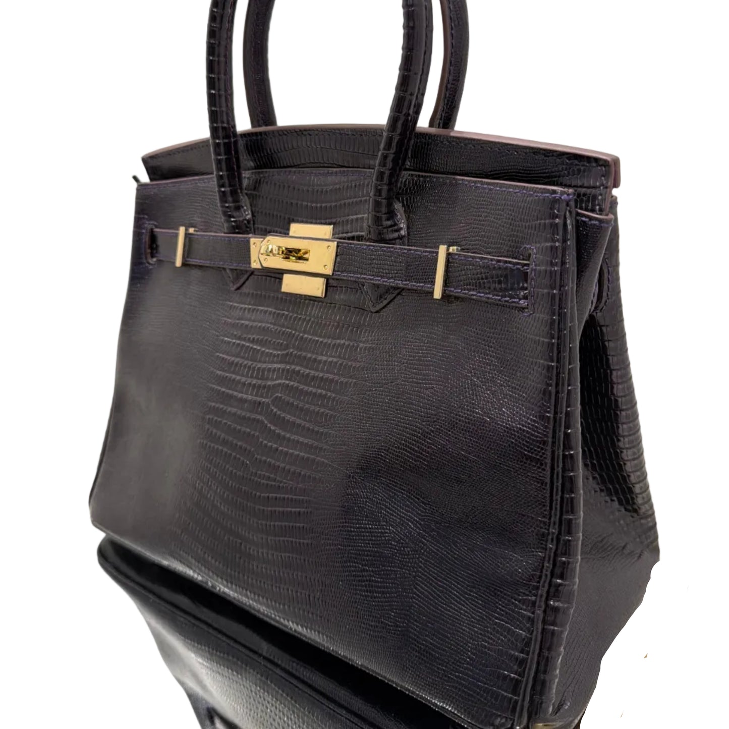 Black handbag with gold accents on a white background