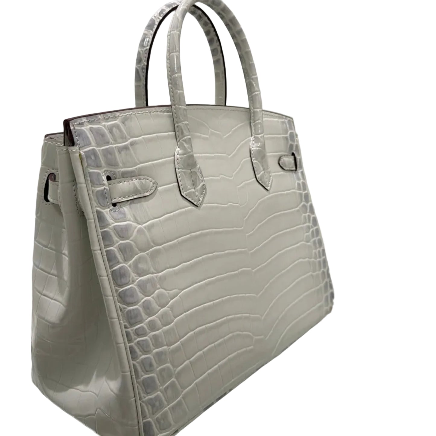 White crocodile-patterned handbag on a white background