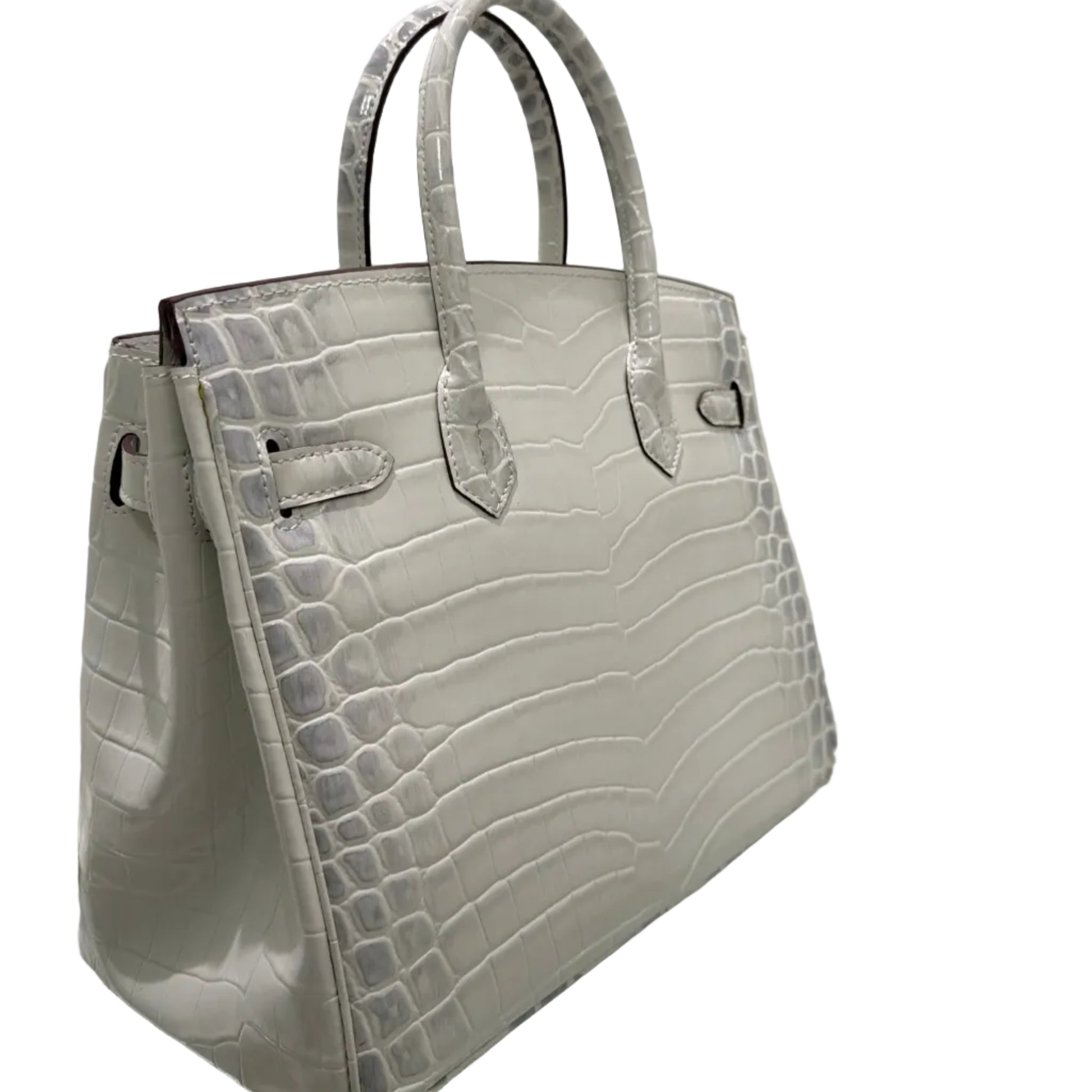 White crocodile-patterned handbag on a white background