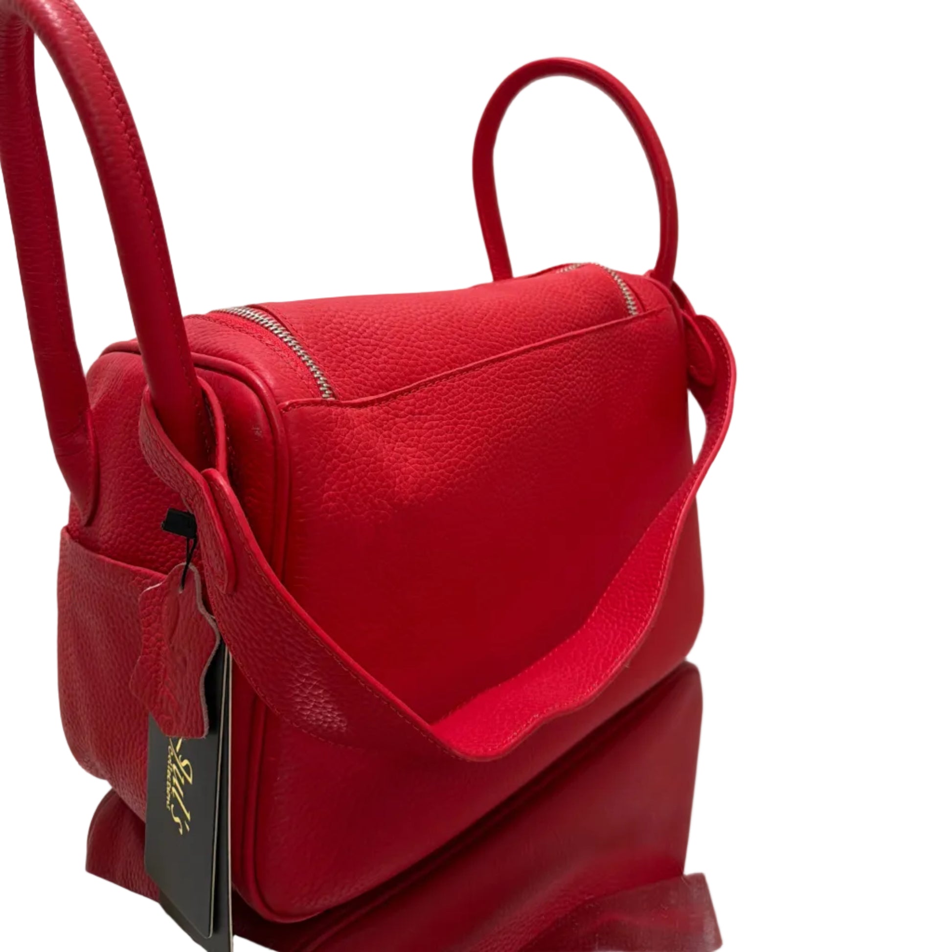 Red handbag with a visible brand logo on a white background