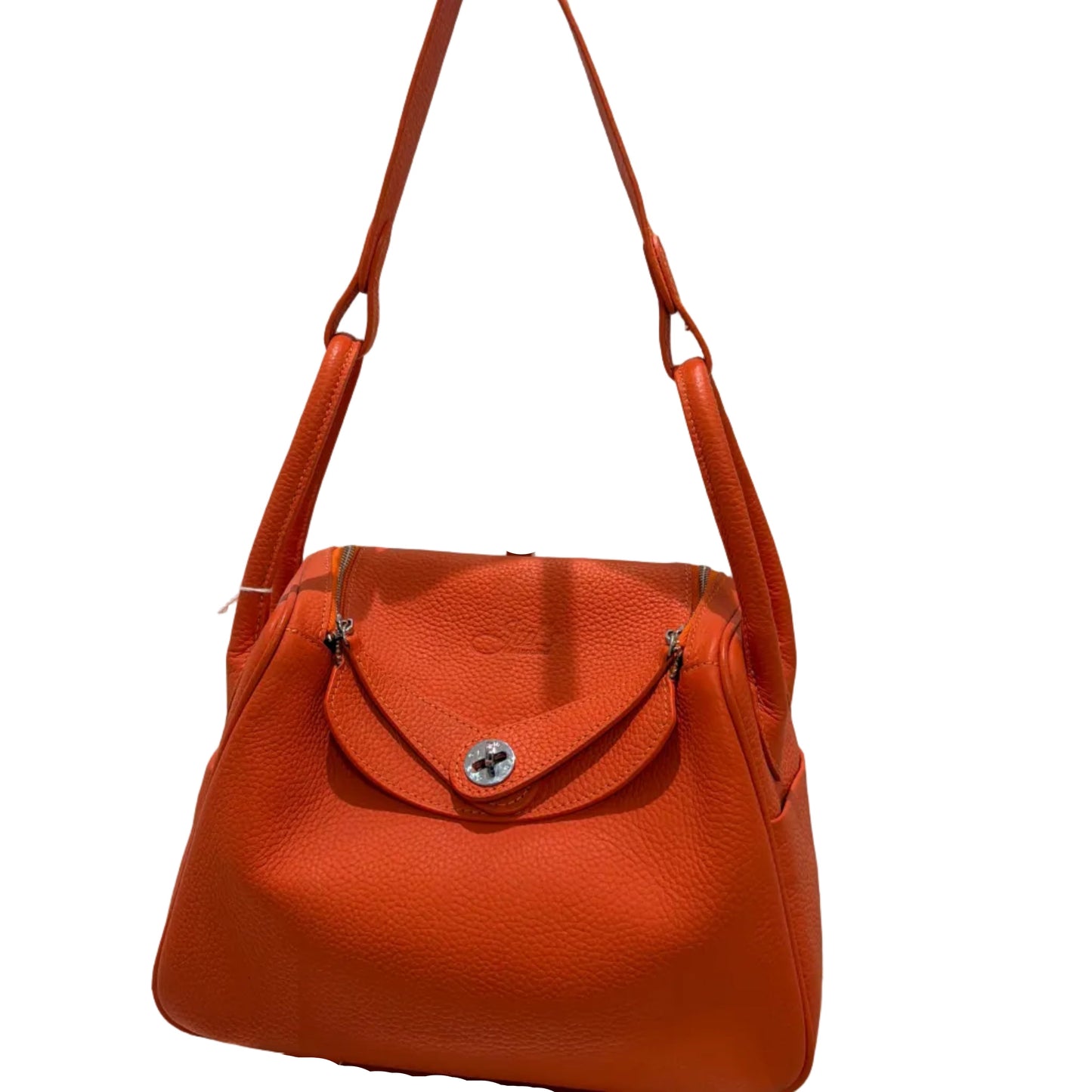 Orange handbag with a visible brand logo on a white background