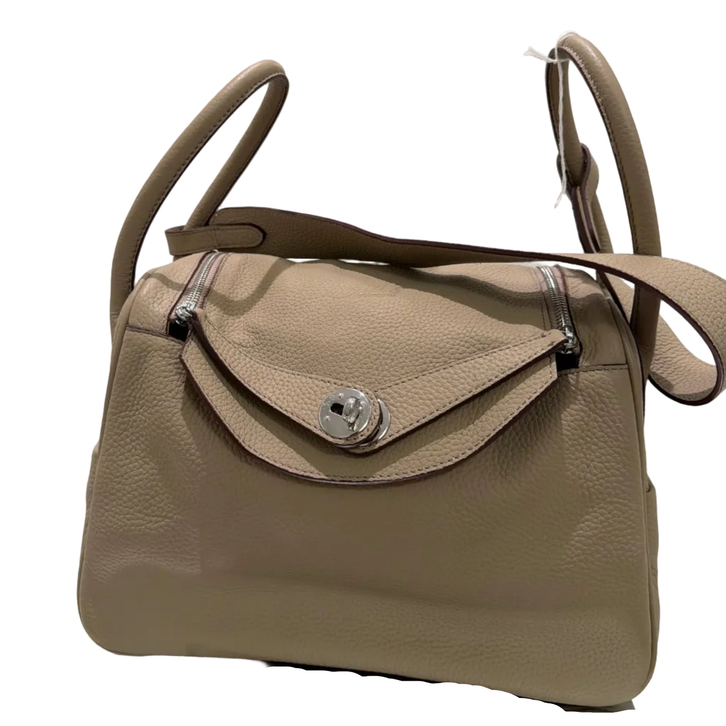 Beige handbag with silver hardware on a white background