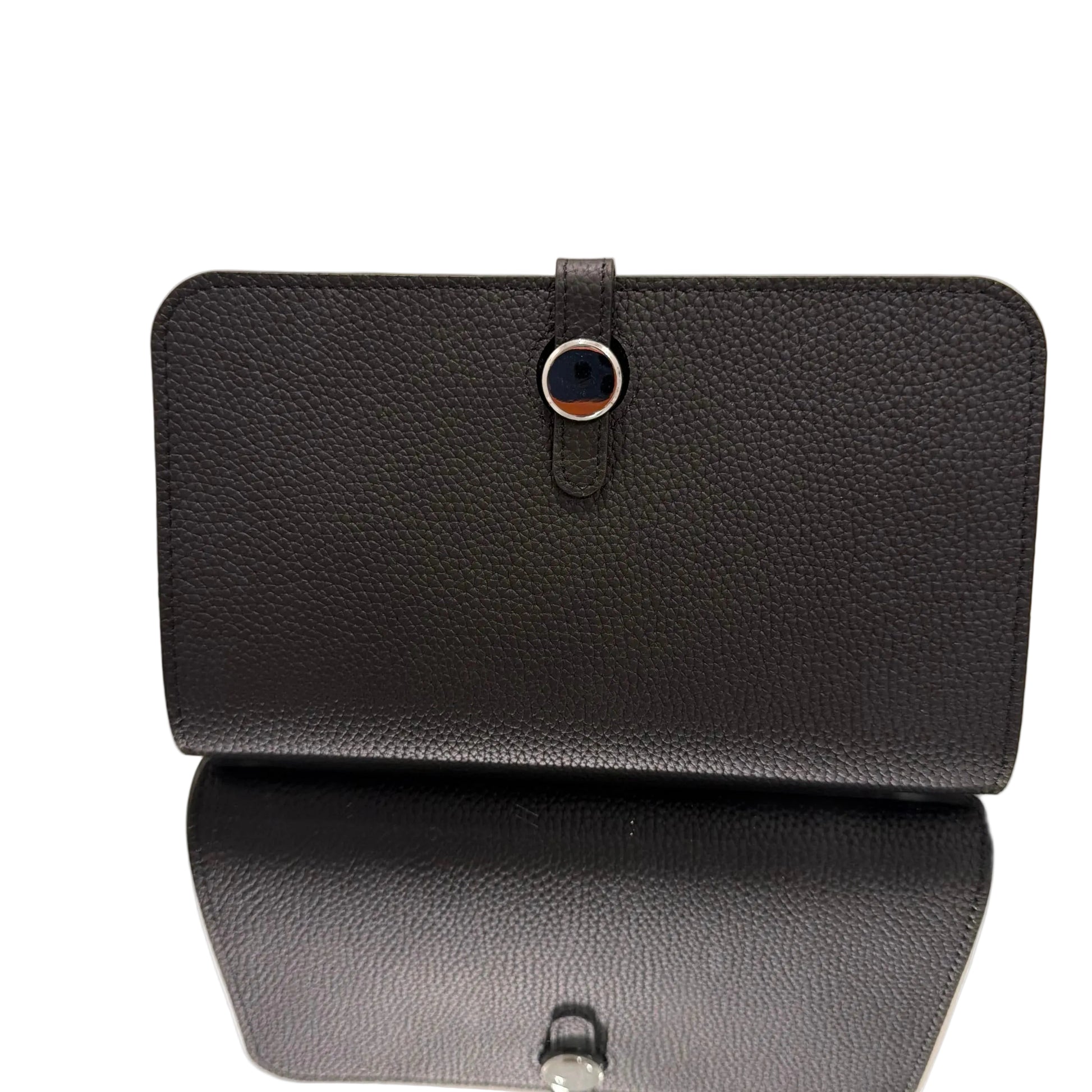 Two black leather wallets on a beige background