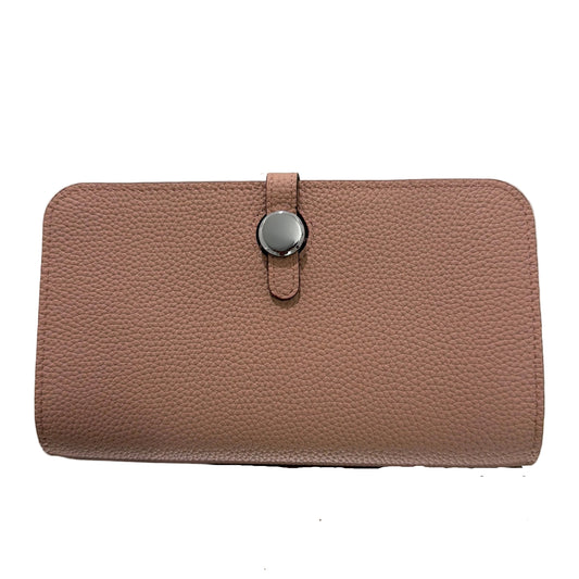 Brown textured wallet with a strap on a light gray background