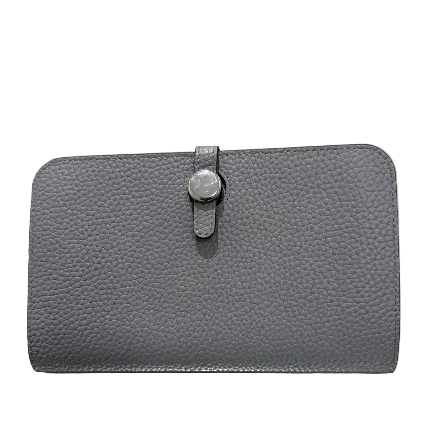 Gray textured clutch bag with a strap on a light gray background