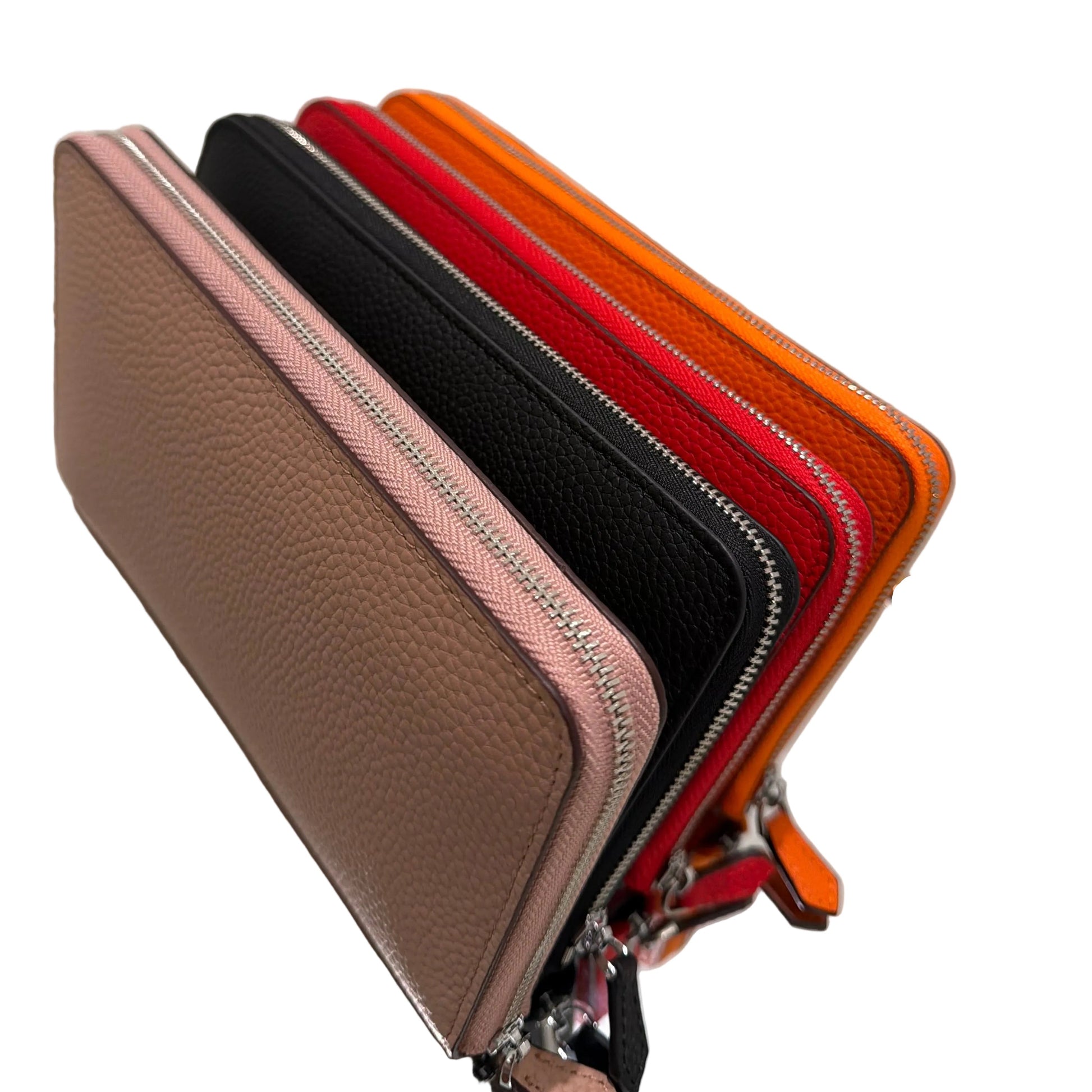 Stack of colorful wallets on a white surface