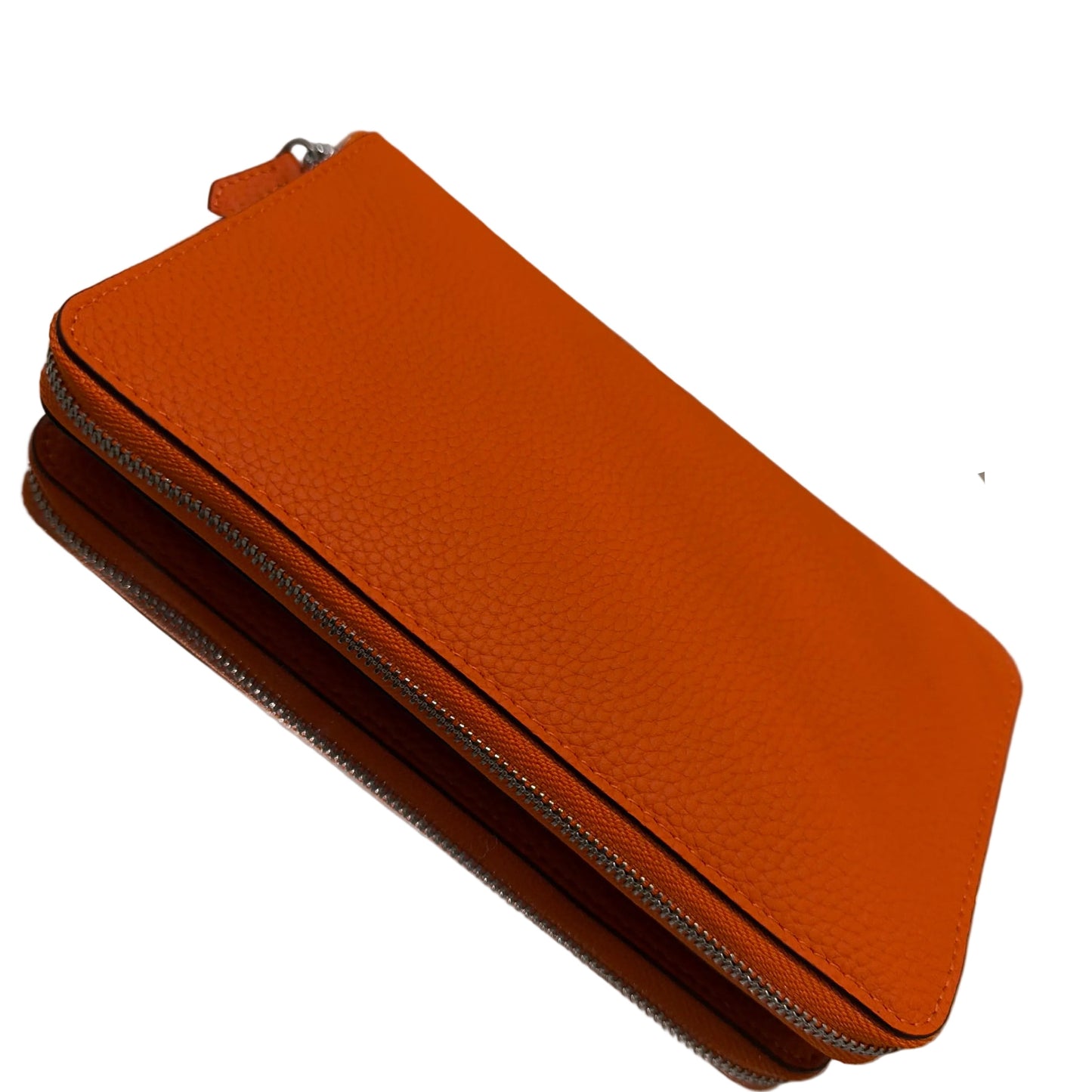 Orange leather wallet on a reflective surface