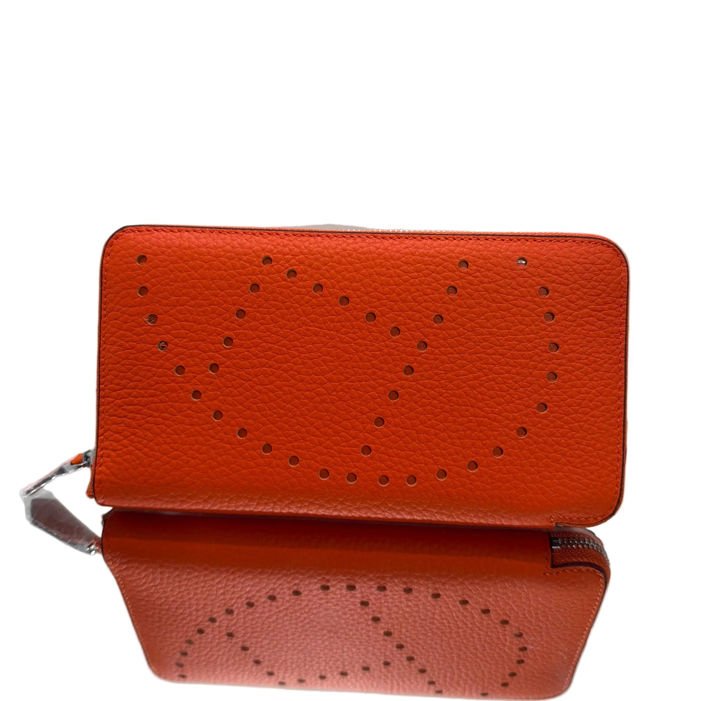 Brown leather wallet with perforated design on a light gray background