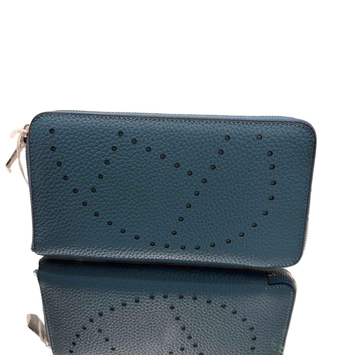 Two blue phone cases with a star pattern on a light background
