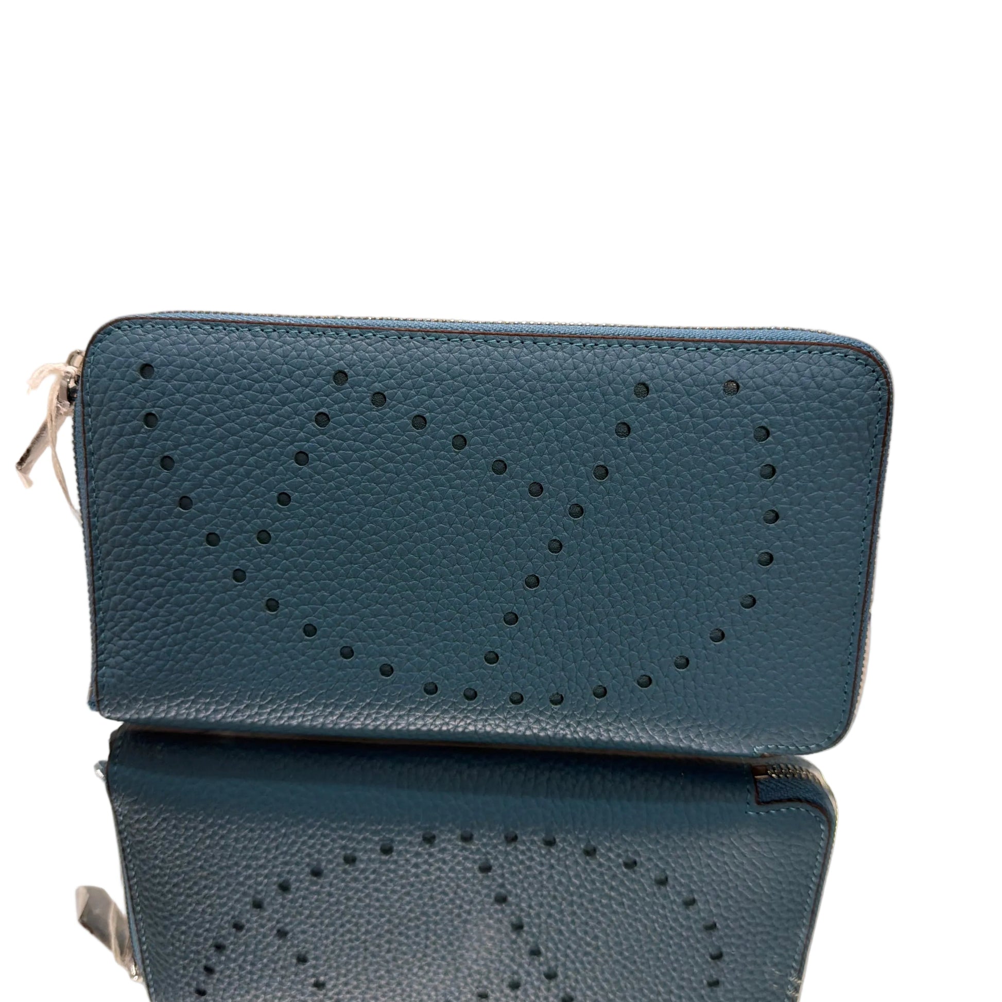 Two blue phone cases with a star pattern on a light background