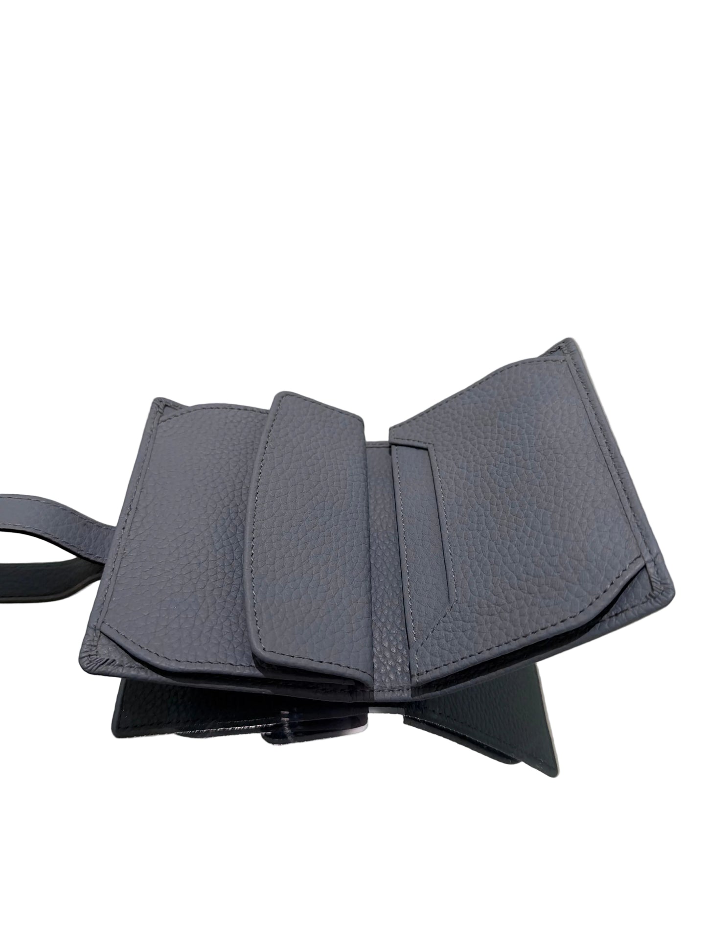 Gray textured wallet on a white surface with a gold frame