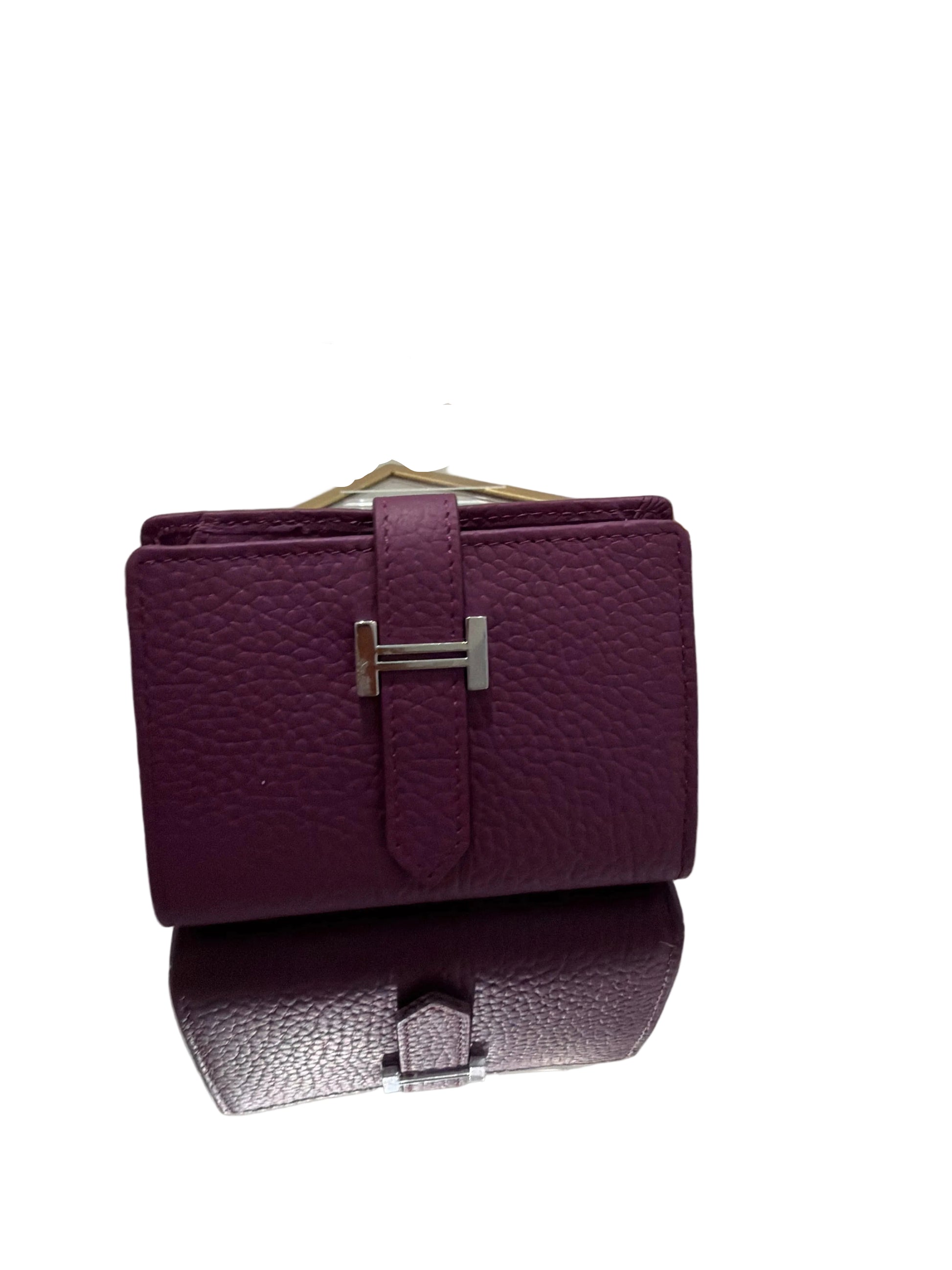 Purple textured wallet with silver clasp on a white background