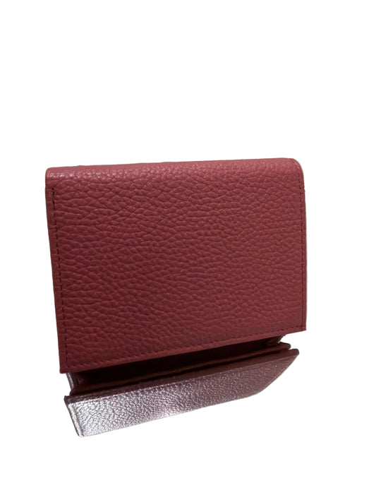 Red textured wallet on a clear stand against a white background