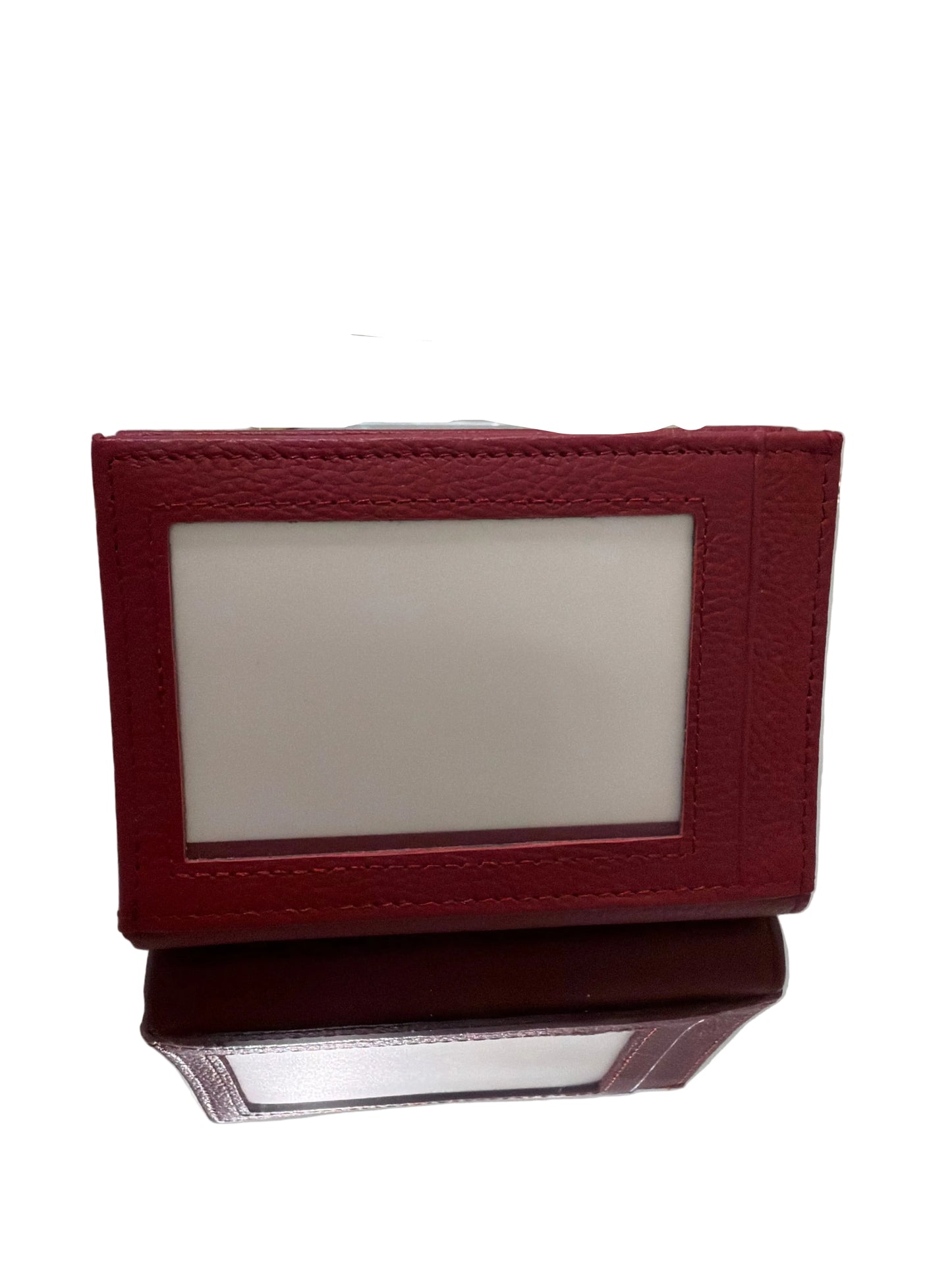 Red leather wallet on a white surface